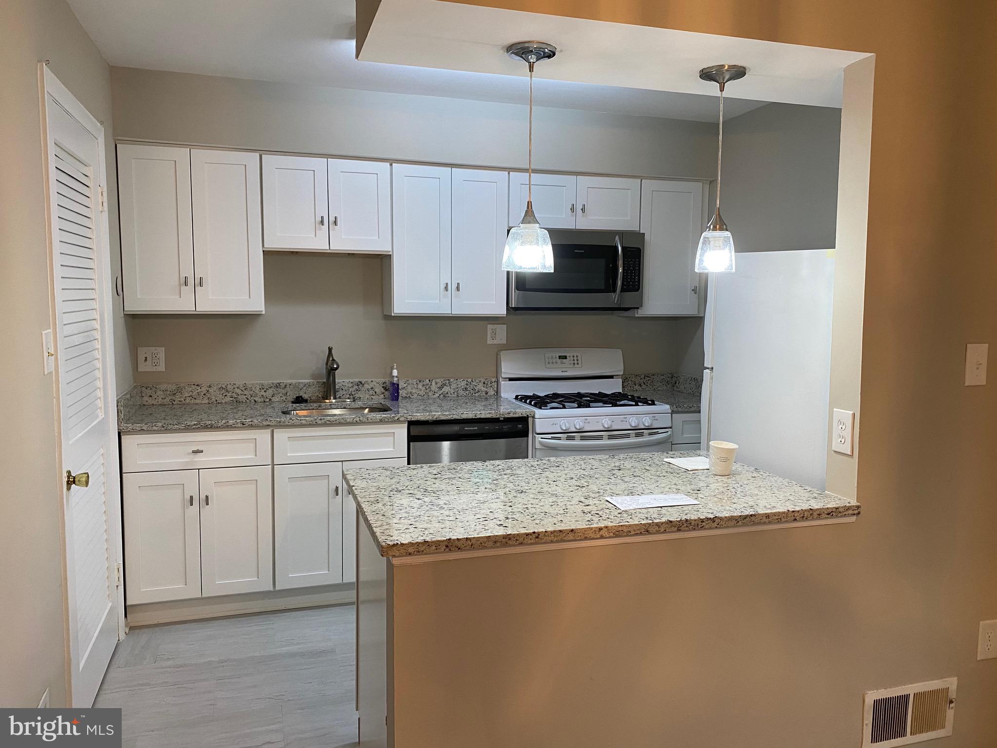 Location! Location! Location! Since the former tenant just moved out, the house is taking care of minor issues. *** This lovely two level townhome offers 3 bedrooms and 1.5 baths to include a spacious master bedroom. You must see this beautifully renovated kitchen with brand new: cabinets, granite, flooring, and a stainless steel microwave. There is a separate dining and living room with Hardwood flooring in the dining room. The home has a brand new electrical panel, the entire home has newer carpet and has been freshly painted. **** New bathroom tile and wall of shower room. If questions, please "TEXT" the listing agent.