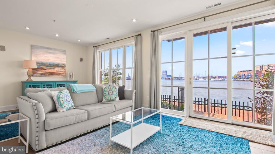 Spectacular  Waterfront Townhome (professional pics to be posted by Thursday 9/7);  beautifully furnished and fully outfitted for entertaining & cooking! Four levels  with elevator in one of Baltimore's premier communities; North Shore. amazing views from every room! Open floor plan with 4160 square feet of living space; 3 bedrooms, 4.5 baths in the heart of Canton. First floor family room with gas fireplace, walk out to promenade, full bath, and two car garage. Second floor open concept - living room with gas fireplace, balcony overlooking the harbor with retractable awning, a chef's kitchen with Viking/Jennair appliances and granite counter-tops, dining area and half bath. Third floor has a library/office, 2 bedrooms, 2 full baths and a laundry room. 4th floor master bedroom suite has a gas fireplace, balcony, walk in closet and large bathroom with separate shower stall and deep soaking tub. Elevator services all four floors. Security system, hardwood floors and recessed lighting throughout. Two-zone air conditioning. Walk to Fells Point, Canton Square, Harbor East and the Inner Harbor, or take the water taxi. Wonderful restaurants, bars and shopping around the corner. Easy access to downtown, Camden Yards and M&T Stadium. Minutes to I-95 and I-895. Available for rent now.  Vacation life style all year round! : )