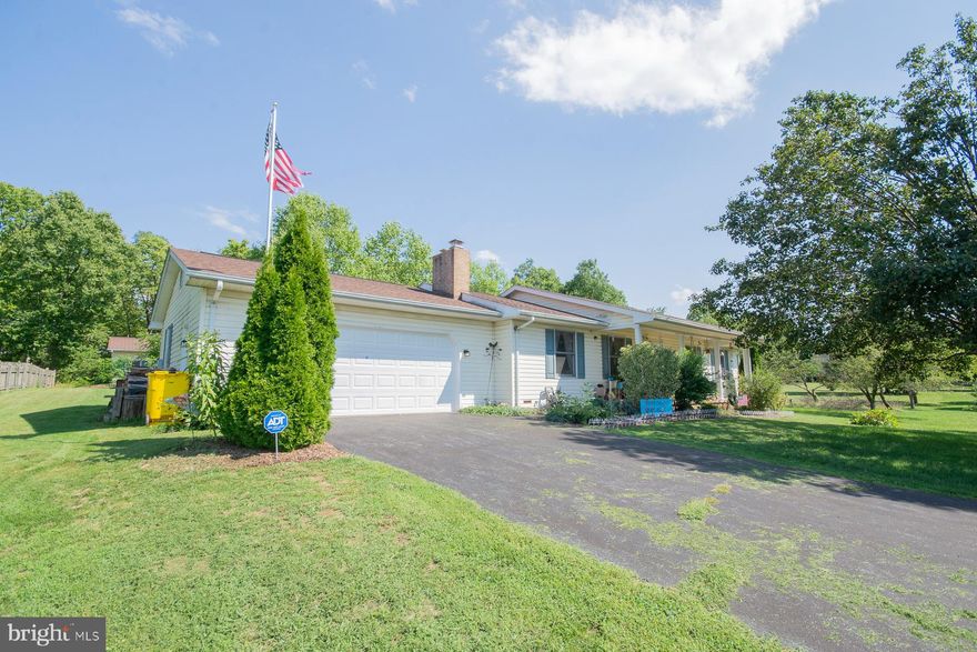 Price Reduced! Discover this charming three-bedroom, two-bathroom rancher located just south of Martinsburg. Nestled on a spacious 0.82-acre lot, this property offers ample room for gardens, family gatherings, and endless outdoor adventures. The home features modern stainless steel appliances and an oversized garage, perfect for all your storage needs. Step outside to find a fantastic workshop in the backyard, complete with a garage door for easy access to your equipment. Enjoy the tranquility provided by mature trees and the serene backdrop of park-like woodlands. The large driveway with a convenient turning area adds to the property's appeal. This home is an inviting sanctuary waiting for you to make it your own!