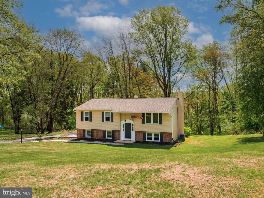 Tucked at the end of a quiet cul-de-sac street in East Brandywine Township, 101 Laurelwood Drive offers the space, privacy, and everyday convenience that make life feel easy. Set on a one-acre lot with a blend of open yard and mature trees, the property strikes a thoughtful balance between usable outdoor space and natural privacy. A charming brick façade and inviting curb appeal welcome you inside. Step through the front door to find vinyl plank flooring and neutral paint throughout, creating a warm, versatile backdrop for any style. The main level begins with a comfortable living room that flows seamlessly into the dining area, an ideal layout for both everyday living and entertaining friends and family. Just beyond, the kitchen is equipped with stainless steel appliances, generous counter space, a closet pantry, and a window over the sink overlooking the backyard. A rear glass door extends the living space outdoors to a two-level deck with a hot tub, perfect for grilling, dining, or simply enjoying the setting. Back inside and down the hallway, the primary suite offers its own full bathroom and ample closet space. Two additional bedrooms share a full hall bath with a tub/shower combo, along with hallway linen storage. The lower level adds flexibility to fit a variety of needs, featuring a spacious family room anchored by a wood-burning fireplace with brick surround and sliding doors that open directly to the backyard. This level also includes a powder room, dedicated laundry room, storage closet, and a fourth bedroom with a private entrance well-suited for guests, extended stays, or a home office. Interior access to the one-car garage adds everyday convenience, while a newly installed shed provides additional storage for outdoor equipment and seasonal items. A new roof (2025) offers valuable peace of mind. While the setting feels private and tucked away, the home is located just minutes from everything that the center of Downingtown has to offer like amazing restaurants, coffee shops, shopping, bars, boutiques, events and more! As well as being close to everyday essentials, community parks, pizza shops, golf courses, and schools. Commuters will appreciate easy access to major routes (30, BUS 30, and 322) along with nearby Thorndale and Downingtown train stations (SEPTA and Amtrak). Loved and cared for by the same family for almost 30 years, 101 Laurelwood Drive is ready for its next chapter. Schedule your showing today!
