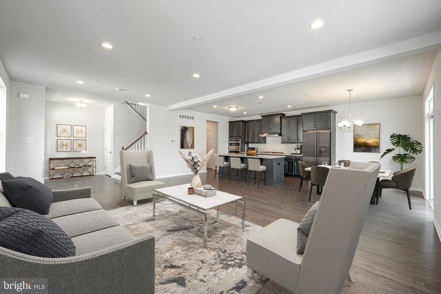 The Thompson Elite Craftsman floor plan provides plenty of space for your busy lifestyle with the
convenience of townhome living. The expansive open floor plan invites your guests to relax by the large island for informal gatherings and holiday feasts alike. Sliding doors off the dining area provide easy access to the deck. Storage is plentiful, as the Thompson offers a large pantry and mudroom conveniently
located between the kitchen and two-car garage. Upstairs, in your primary bedroom retreat, choose between one oversized walk in closet, or dual walk-ins with a dressing room adjoining your private primary bath. Two additional bedrooms, a hall bath, and laundry closet complete the upper level. East Village is located in the award-winning Downingtown School District. Residents of East Village will enjoy resort style amenities including a community pool, clubhouse with gathering room and a fitness center, sidewalks, walking trails, and a playground. Note that this home is to be built and photos are of a similar model.