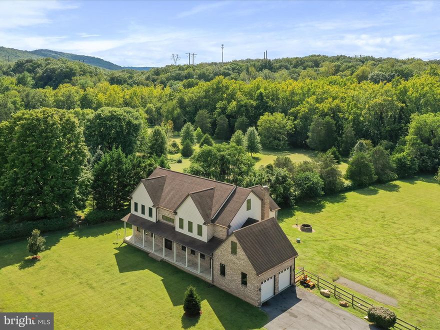 Stunning colonial home situated on 2 private acres, less than 2 miles from the scenic Shenandoah River! This beautifully maintained 4-bedroom, 5-bathroom home offers spacious living with elegant finishes throughout. The main level features bamboo flooring, a grand staircase with wrought iron spindles, a large gourmet kitchen with granite countertops, gas cooktop, double ovens, smart refrigerator, walk-in pantry, and a spacious formal dining room (table & chairs convey). Enjoy a formal sitting room, flex space or office, and a vaulted great room with a stone gas fireplace. Two staircases provide convenient access to the upper level, which includes 4 bedrooms and 3 full bathrooms. The expansive primary suite offers a jetted tub and a large walk-in closet with built-ins. There's another finished room in the attic space, that's fully carpeted.  Finished bonus room over the garage provides endless possibilities. The fully finished basement includes durable LVP flooring, a full bathroom, wood stove, and a bar—both of which convey—making it perfect for entertaining. Outdoor living includes a screened-in porch, an open deck, a fire pit area, and an attached 2-car garage. The home is equipped with a Culligan water softener system with regular inspections and salt delivery. Dining room set, basement bar, mirror, wine rack and wood stove in the basement all conveys. Buyer to verify all information. This is a must-see property offering space, charm, and thoughtful upgrades throughout! Seller has provided all information regarding the property to the best of their knowledge. Buyer to perform their own due diligence.