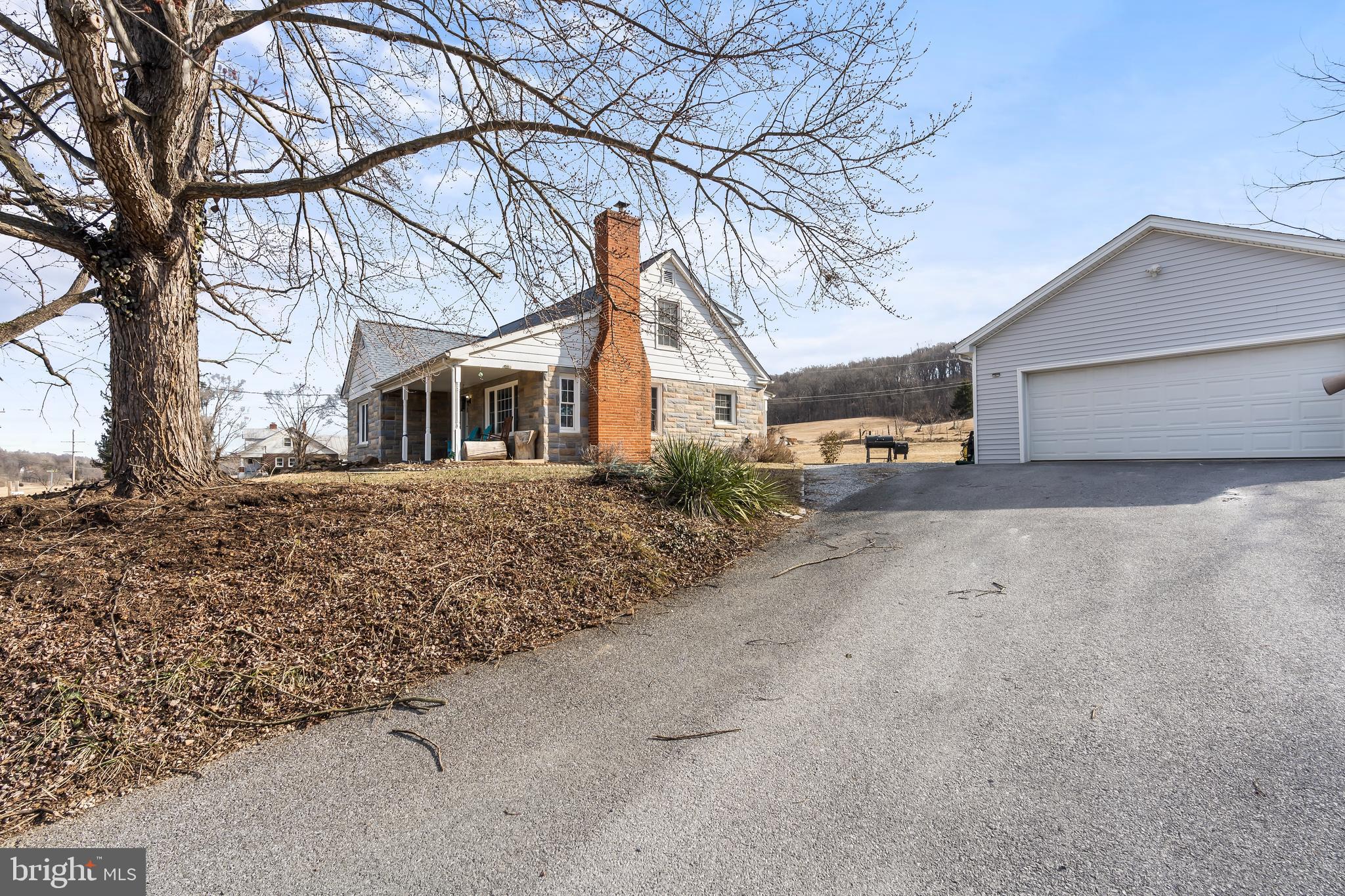 Gorgeous Inside and Out with a view directly across from Harper’s Ferry National Park Grounds and right off of 340! This renovated well-loved 4 bedroom, 2 bath Cape Cod is situated on 1.4+/- acres within Harper's Ferry WV. A commuters dream location to Virginia or Maryland. Enjoy the peaceful setting with the detached garage, chicken house/run, greenhouse, an abundance of fruit and a variety of beautiful trees and berry bushes, The garden area is protected from wildlife to prevent your homestead grown harvest from being destructed. The house is wired for a generator. The basement has inside access, it is dry and ready for additional finished living space that opens to a walk-up staircase to the rear yard. New Roof on the house and garage; refinished hardwood flooring, updated bathrooms, and the meticulous drywall work with smooth as butter texture are just some of the recent changes. Seller septic is being pumped on or about 2/25/25.