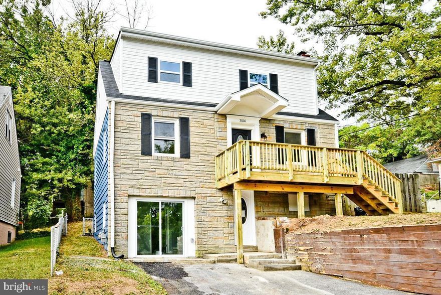 Amazing opportunity for anyone with a large family or someone looking to make rental income. This home was recently fully renovated and completely weather proofed. 5 bedrooms and four full bathrooms throughout!  Both the Master and Junior Master bedrooms have ensuite bathrooms. The main level has a nice open floor plan, great for entertaining. The basement has a second entrance with its own full bathroom, bedroom, living space, and bar area. Great for a basement apartment! This one won't last long! Seller is motivated!