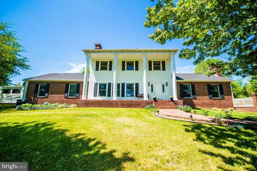 Gated Entry 25+ acre home on Smith Creek with panoramic views to the mountains. A wonderful and rare opportunity with over 1100 feet of water frontage. Main level master suite, oversize detached garage. Ideal equestrian property with fenced pastoral fields, paddocks OR entertaining with amazing views, in-ground pool, privacy & serenity surrounding the property. Priced below assessed value.