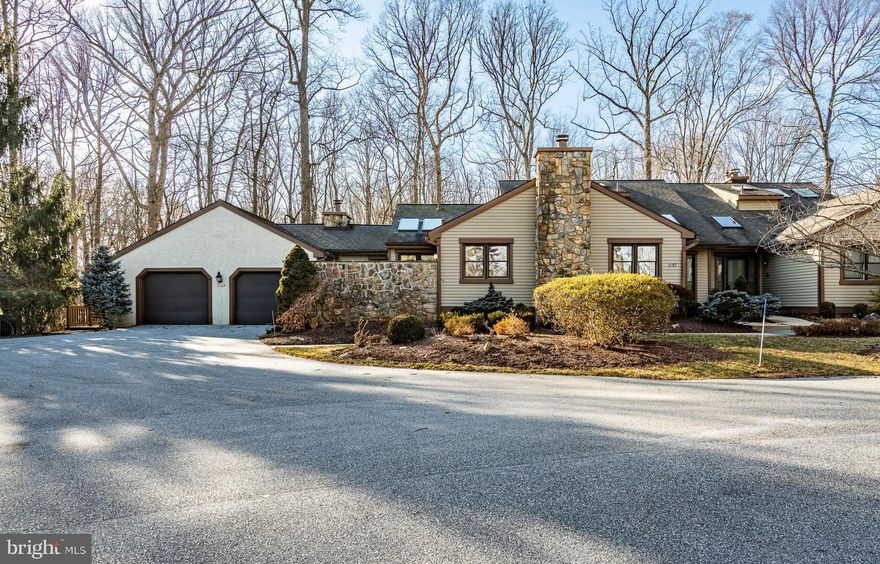 This end-unit luxury carriage home is one of the best locations in the community, with views of open space and scenic golf course views. You enter a dramatic two-story foyer with skylights, a spacious formal living room with a cathedral ceiling and two skylights, a Formal Dining room tray ceiling, crown and chair rail moldings, and a Sun Room with wrap-around windows access to the outside entertainment deck.  Gourmet kitchen with center island, stainless steel appliances, double oven built-in microwave, and abundance of cabinetry, breakfast room.  Family room with fireplace, cathedral ceiling with access to a private courtyard and half bath  The primary bedroom includes fireplace and full bath and finishing off the first-floor living space is a full-size laundry. The upper floor offers an additional full bath, a spacious bedroom, and additional living space for numerous uses open to and overlooking the first floor. The basement area is plumbed for a full bath, a separate room with built-in wine racks, a cedar closet, and a storage room/utility room. HVAC unit new on 1/26/2018 and hot water heater 12/20/2017. Natural decor and site finished hardwood flooring throughout. Located in Hershey's Mill, a Chester County Premier 55+ Active Lifestyle Community.