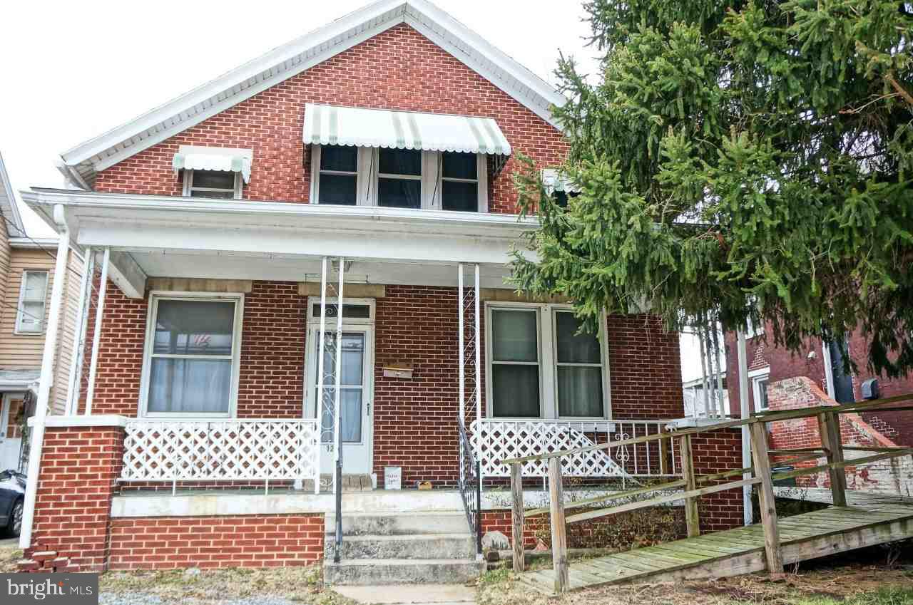 Looking for an affordable home and a place for your boat or bike? This all brick home feat high ceilings, wood floors throughout, original wood trim and covered porches front/side and back. Updates include kitchen and appliances, roof, electric, furnace & hot water heater. Laundry hookups on the 1st floor and basement. Also boasting off street parking, fenced yard and 3 car garage w/electric, used for storage of those boats & bikes due to access. Would also make a great workshop with a little work.