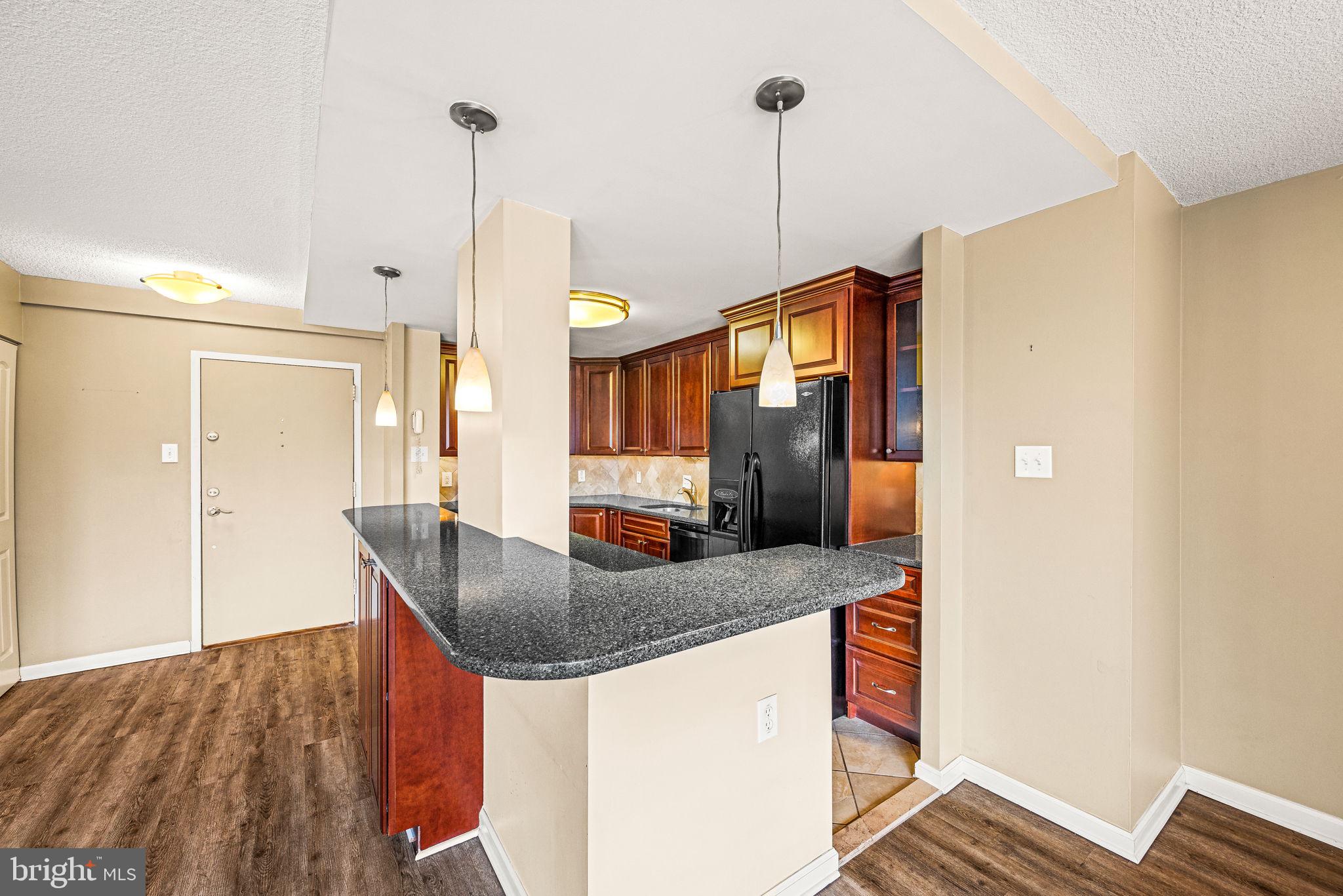This fully updated 2-bedroom, 2-bath condo offers stunning eastern views, filling every room with soft morning light. Located in the prestigious Strath Haven Condominiums, a Gold Star Community recognized by the Community Associations Institute, this residence combines comfort, convenience, and an exceptional quality of life. Situated near Swarthmore’s charming town center, the property provides easy access to Swarthmore College, the Scott Arboretum, local shops, and the regional train station. Renovated in 2008, this condo features a thoughtfully designed open-concept layout. The original kitchen and dining room walls were removed, creating a spacious and functional kitchen that seamlessly flows into the living and dining areas—ideal for entertaining. At the heart of the kitchen is a large two-tiered island with bar-height seating, perfect for casual dining. Ample counter space accommodates multiple cooks, while abundant cabinetry provides generous storage. High-end finishes such as cherry wood cabinets, granite countertops, a tumbled marble backsplash, under-cabinet lighting, and a neutral ceramic tile floor add warmth and elegance. The open and airy living room extends effortlessly to a generous private balcony, accessible through a sliding glass door. Large enough to accommodate a café table and chairs, the balcony is an inviting space to enjoy a morning coffee while watching the sunrise or to unwind with an afternoon drink. Adjacent to the living room, the dedicated dining area provides space for a formal meal. The spacious primary bedroom comfortably fits a full suite of furnishings and includes two large closets for ample storage. Its updated en suite bathroom features a convenient stall shower, offering both privacy and ease. The second bedroom is equally well-sized, with a large closet and direct access to the hall bathroom, which includes a bathtub/shower combination. A laundry closet with a stackable washer and dryer, along with additional storage space, adds to the home’s practicality. Strath Haven Condominiums offers an impressive range of amenities designed to enhance residents' lifestyles. Enjoy access to an outdoor swimming pool with changing rooms, a lending library, a hobby workshop, a meeting room, and a card and game room. The vibrant community also hosts book clubs, social gatherings, and a complimentary van service for shopping trips to nearby areas, including Booth’s Corner Market and H Mart. The monthly condo fee is one of the most comprehensive in the area, covering electricity, gas, water, sewer, heating, and air conditioning—providing a truly maintenance-free living experience. This beautifully updated condo, situated in a renowned community with outstanding amenities.