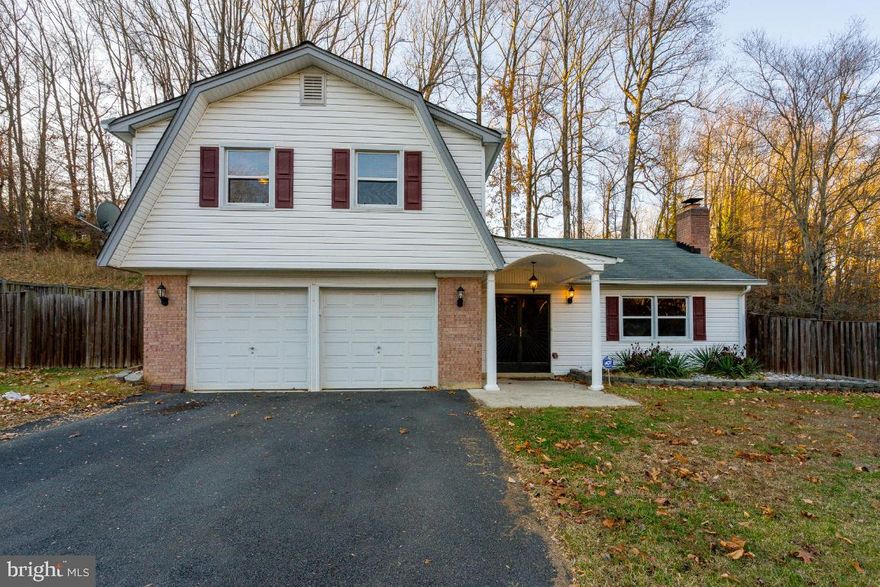 Don't miss out on this beautifully renovated, spacious and charming family home with 2 levels that shows extremely well! Recently updated kitchen with granite countertops and newer appliances. Updated bathrooms. Newer ceramic flooring in the bathrooms, kitchen, foyer, laundry/utility room, and hallway. Brand-new carpet, newer hardwood on main level, and large family room with a fireplace makes for a cozy home. It has great curb appeal. The deck overlooks a well-manicured, huge yard. Your Family will LOVE living in this spacious single-family home!