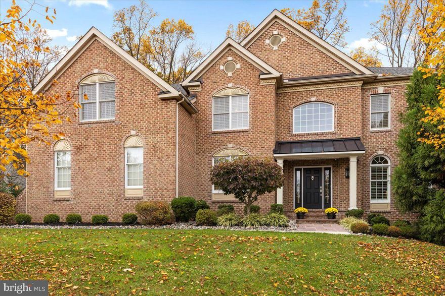 Once you step inside 4376 Wentworth Court, you will know you are home! Tucked away on a secluded cul-de-sac in the highly-sought after Upper Mountain Estates community, this stately 4 bed, 3.1 bath home exudes luxury at every turn. From the stunning foyer, you'll appreciate the grand curved staircase, crown molding and elegant wainscoting. To your left, a light-filled private office with French doors provides a quiet space to work from home. Follow the showstopping, handscraped hardwood floors that run throughout the home to its centerpiece - a fully updated gourmet kitchen, complete with a new oversized kitchen island, high end stainless steel appliances, six-burner gas stove, wine refrigerator, granite counters, and ample cabinetry for all of your kitchen storage needs. Enjoy morning coffee in the spacious breakfast nook while watching news on the TV in the adjacent great room, with both wood-burning fireplace and wall of windows. The tasteful dining room and versatile living room provide the optimal settings for casual or formal entertaining. Walk through French doors off the kitchen to the large patio with built-in grill and private backyard oasis with lush, mature landscaping that looks out over 200 acres of protected open land. Completing the first level is a sprawling, oversized laundry room with attached mudroom leading to a pristine 3-car garage with newer upgraded doors and a Tesla charging station. Up the formal front staircase or the casual back staircase, you'll find the primary owner's suite, complete with gorgeous millwork as well as a sitting area with gas fireplace to unwind after a long day. Custom walk-in closets with hardwood floors flank the primary bathroom suite, boasting a large soaking tub, separate shower area, and dual vanities. Down the hallway, there are three additional bedrooms, two sharing an updated jack-and-jill bathroom and the other with its own renovated bath. Rounding out the upper level is a spectacular bonus loft with a shiplap wall and custom built-in storage cabinetry - the ideal place to curl up with a good book or a cup of tea. The home's lower level includes roughed in plumbing for a future bathroom, tankless water heater, and abundant square footage with generous ceiling height to suit all your needs. This home has been thoughtfully and meticulously maintained and has so many upgrades it's nearly new construction inside and out - new exterior portico and sidewalk path, new windows, new siding, Gutter Guards, exterior lighting, whole house generator, plus newer light fixtures, recessed lighting, plantation shutters, and fresh paint. There is even more for you to discover and fall in love with when you visit 4327 Wentworth Court.