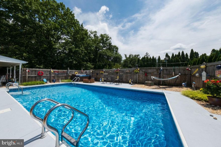 Welcome to your Staycation Home!  Enjoy the beautiful summer days at your pool with a hot tube on the side.  The large covered patio (pictures coming) and backyard allow you and your guests to enjoy games and other activities.  As you tour the home, you will immediately notice the care and upkeep of these longtime owners. The kitchen has been updated with a granite countertop, ceramic backsplash, 
 newer appliances, garbage disposal, and wood floors. With an open floor plan into the dining room, it makes indoor entertainment a breeze. On the lower level, you will find a large Family room with a beautiful Stone gas fireplace and a half bath. The 2 car oversize garage gives you lots of storage and workspace. This home also boasts gas heat, central air, well water (no water bills!) infrared light, replacement windows, gas cooking,  and a shed in the backyard. More pictures coming next week. Showings Start August 1, 2024  Exeter School District