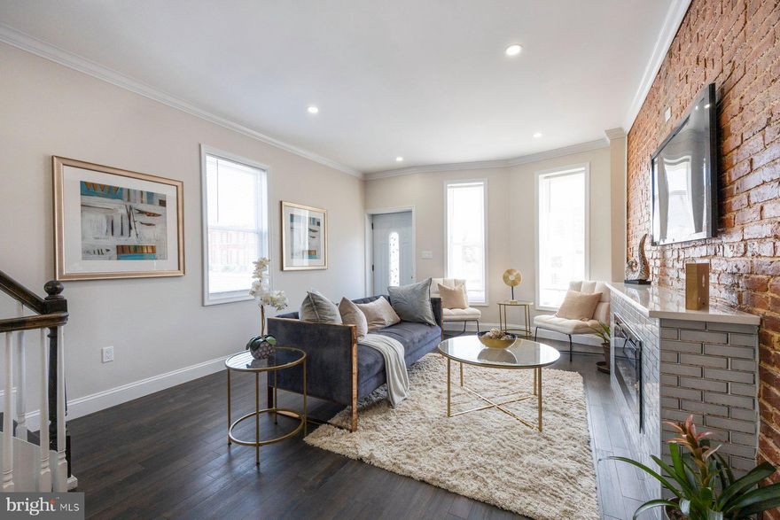 Welcome to this contemporary fully renovated oasis. Stunning workmanship and design in this end of group classic Baltimore Row Home.  Located in the heart of East Baltimore. Step in and be amazed by the transformation. An open floor plan with tons of natural light, kitchen made for a chef with his end stainless steel appliances, custom countertops and high end cabinets. A Fully finished lower level with a conversation area for entertaining , full high end bath, and energy efficient washer and dryer. The upper level has 3 full bedrooms and a custom designed bath. Accessible to downtown and I95. Tons of grant programs and down payment assistance available . Seller is motivated and wants you to enjoy this masterpiece. Get in this hot up and coming area now. ..