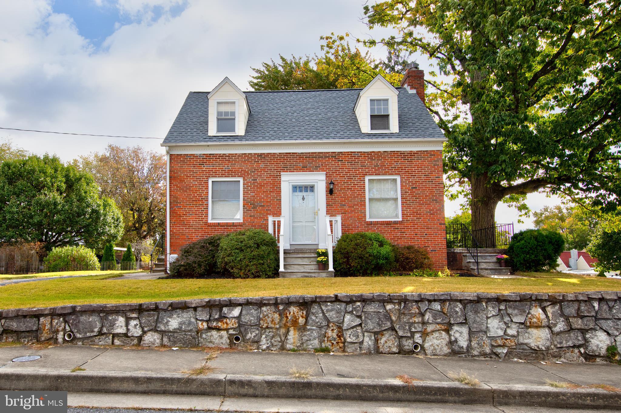 Well maintained brick Cape Cod. This freshly painted home boasts beautiful hardwoods throughout the house. Enjoy the wood burning fireplace in the living room for cozy fires. Over sized lot with storage shed. Also, off street parking.