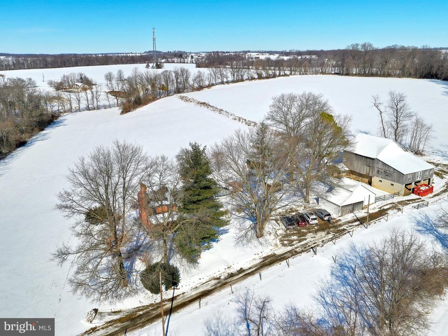 Southern Lancaster County farm with 18 acres tillable and low taxes . Numerous outbuildings including a bank barn with horse stalls. The log and brick farmhouse had a major studs out renovation in 1986. The owners suite features a brick, gas fireplace, freestanding tub, and walk in closet. The home offers 4 other   flues and fireplaces, wood floors and an Elmira cookstove in the kitchen.  Here's your chance to own a farm in a private setting with a stream. Property being sold as is with inspections for buyers information only.