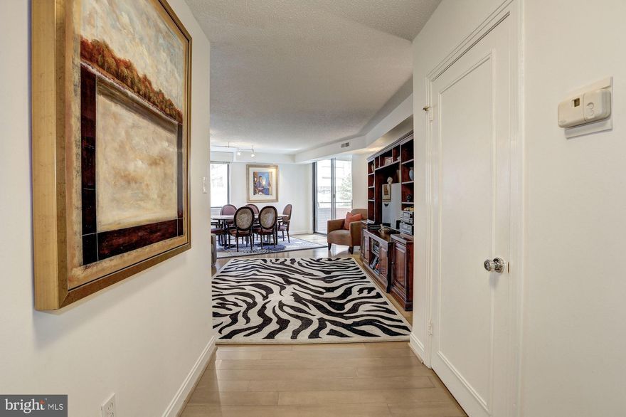 Beautiful, spacious unit in ideal Chevy Chase/Friendship Heights location. 87 Walk Score! Expansive three bedroom, two bath unit with gorgeous finishes such as granite counters, stainless steel appliances, two balconies, custom built wet bar with fridge and wine storage, 24 hour front desk coverage, walk-in closets, master suite with attached office, washer/dryer. Building has outdoor pool, fitness center, sauna,  two assigned parking spaces, four assigned storage units. Extremely reasonable condo fee. This spectacular condo truly has it all.