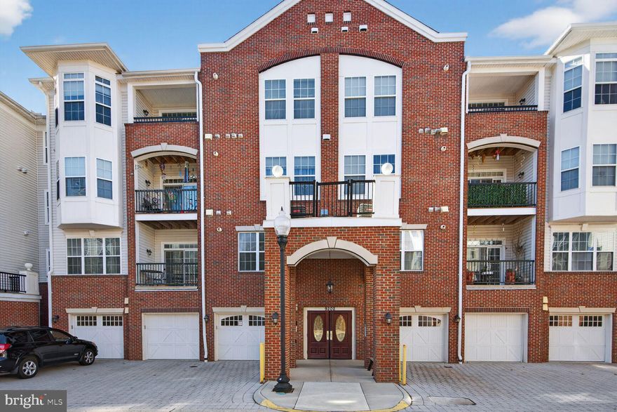 Welcome to 9202 Charleston Drive #307, an extraordinary home in The Gatherings at Wellington Village, a sought-after 55+ active adult community in the heart of Manassas. This spacious three Bedroom, two Full Bathroom corner unit offers the largest floor plan in the community at 2,006 square feet, giving you more space than many townhomes and single family homes. With its logical and open layout, soft neutral palette, and abundant natural light, this home is both welcoming and functional.

The entire condo was just FRESHLY PAINTED and BRAND NEW LVP FLOORS were just installed at the end of December 2025!

Step inside the large Foyer, where brand new flooring and a roomy coat closet set the tone for the thoughtful design found throughout. The Living Room is incredibly spacious, perfect for entertaining or quiet evenings at home, and flows seamlessly into the Dining Room, highlighted by crown molding, shadow boxes, stately columns, and large sunny windows. Just beyond, a private Balcony with Trex decking provides the perfect spot to sip your morning coffee or unwind in the evening while enjoying seasonal views of colorful trees.

The Kitchen is a true standout, designed with both form and function in mind. Featuring stainless steel appliances, gas cooking, Baltic Brown granite counter tops, a breakfast bar, eat-in dining space, and a huge pantry, it offers everything you need for everyday meals and gatherings alike. Hardwood floors, modern lighting, and sunny windows make this space as inviting as it is practical.

The Primary Suite is an expansive retreat, large enough for a King sized bed with room to spare, and enhanced by a tray ceiling, plush carpet, a ceiling fan, and four windows that fill the room with natural light from two exposures. The enormous walk-in closet provides ample storage, while the spa-inspired en suite Primary Bathroom feels like a private oasis. Complete with a double vanity, oversized walk-in shower with decorative tile and built-in seating, and a luxurious soaking tub, this Bathroom is the perfect place to relax and recharge. Two additional spacious Bedrooms, each with large closets and sunny windows, provide versatility for guests, hobbies, or a home office. A second Full Bathroom with a soaking tub and ceramic tile completes the thoughtful layout.

Everyday convenience is elevated by a PRIVATE Garage located inside the building, complete with additional storage and a driveway for a second vehicle! No need to walk outside or across a parking lot—your garage is right there for easy access. 

The monthly Condo Fee covers water, sewer, trash, snow removal, lawn care, and professional management, as well as access to community amenities. Enjoy the clubhouse with kitchenette and gathering space, fitness center with cardio and weights, outdoor patio with grill, tennis court, gazebo, and beautifully maintained common grounds.

The location is ideal, just minutes from Old Town Manassas with its array of restaurants, cafés, shops, and entertainment. Stroll through boutiques, dine at local favorites, or enjoy seasonal events at the Harris Pavilion. Nearby, Wellington Station offers convenient shopping, dining, and services, while the Manassas Library is just steps away. For commuters, multiple bus stops, the Manassas Train Station, and major routes are all easily accessible. Cultural and recreational opportunities abound with the Manassas Museum, Central Park Aquatics Center, Freedom Aquatic & Fitness Center, Manassas Mall, and the critically acclaimed Hylton Performing Arts Center all nearby. You’ll also enjoy local favorites like Two Silos Brewery and the weekly Farmer’s Market just minutes away.

Combining the comfort of a thoughtfully designed home, the convenience of low-maintenance living, and the vibrancy of a connected community, this condo at 9202 Charleston Drive #307 offers the best of Manassas living. Don’t miss the opportunity to make this spacious, light-filled retreat your next home.