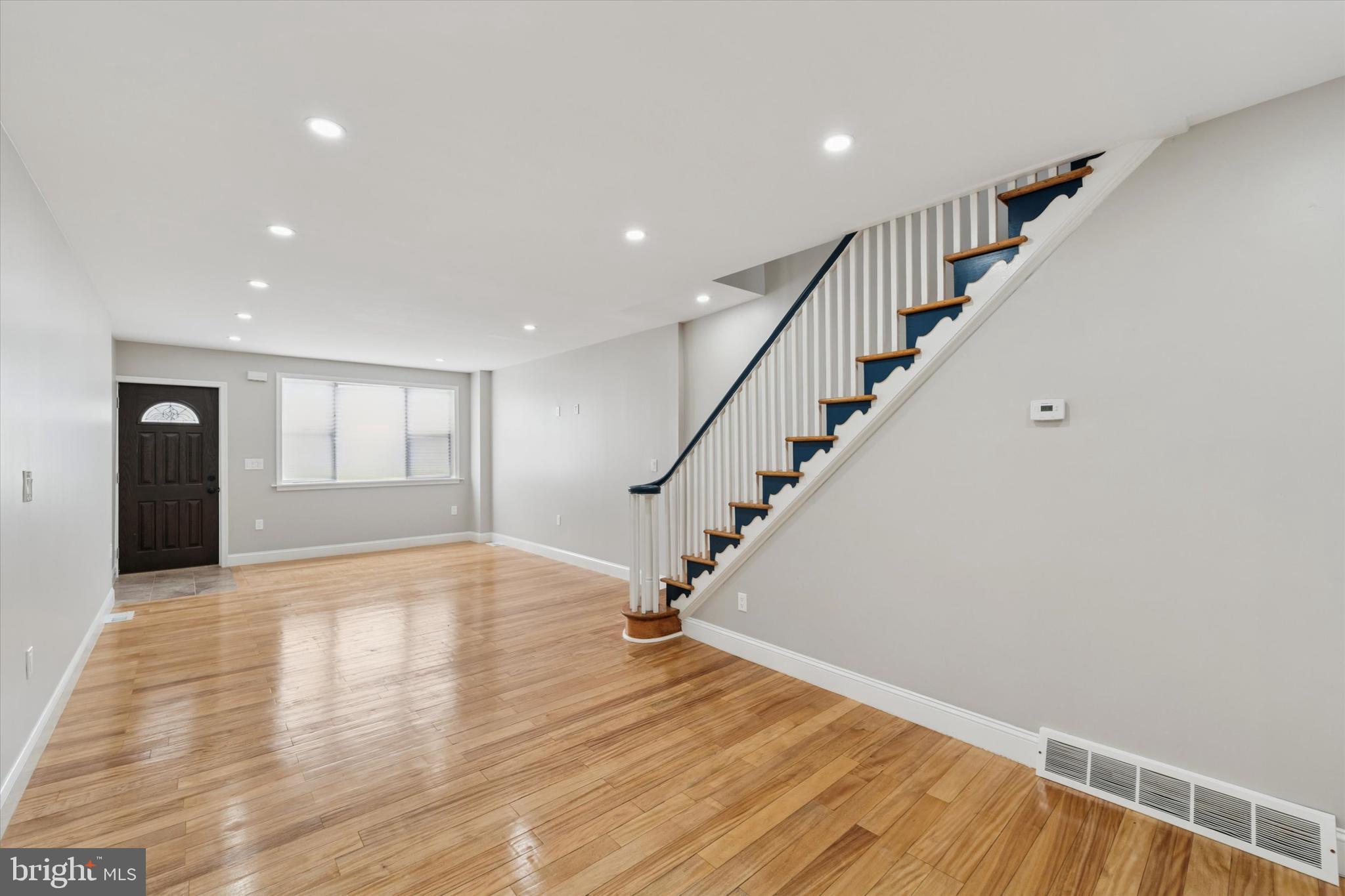 This move-in ready rowhome with key updates is in a fantastic South Philly location. Warm flooring complemented by the perfect shade of greige walls and recessed LED lighting run throughout, combined with lots of lovely natural light to create a bright, airy and spacious vibe. The open living space with maple floors and plenty of room for living and dining gets great eastern light from an oversized front window. The super charming staircase has its original banister intact, and a contrasting navy blue and white paint palette highlights its sweet decorative elements. The home’s historic charm continues in the kitchen, where the vintage black and white full-wall tile was preserved. There’s good storage via the freshly painted white cabinets, open shelving and a freestanding storage and workspace combo. The stainless steel undermount sink with pulldown gooseneck faucet and appliances are anything but vintage–there’s a Bosch French door fridge, Samsung five-burner range with convection oven and a Whirlpool over-range microwave that vents out. The rear patio offers plenty of room for a grill and bistro set or container kitchen garden, and down in the basement there’s ample space for storage plus laundry hookups conveniently located right near the bottom of the stairs. Upstairs there’s new luxury vinyl flooring running throughout the three sunny bedrooms.The good-sized rear bedroom has a west-facing back window, while the middle true bedroom opens to a super private side balcony. There’s a large hall closet and full bath with skylight and full-wall ceramic tile surround for the tub with glass doors and rainhead faucet. The largest bedroom in front has a picture window facing the architecturally significant Bok building–did we mention that this home is steps away from that community hub, with over 200 locally owned businesses, shops, restaurants and of course, that Instagram famous rooftop bar? Plus with Snyder Ave two blocks south, Passyunk Ave four blocks east and Dickinson Square Park just beyond to the west, you’ve got the best of the rest of South Philly within easy reach.