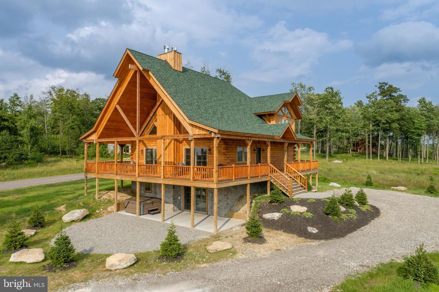 NEW CONSTRUCTION! Rustic Log Lodge located in the sought-after North Camp Ridge! One minute from the slopes at WISP, this 6Bed 5Bath features picturesque long range mountain views, massive wrap around deck and two stacked stone fireplaces. Two additional half baths, 4 Ensuites and a Jack-N-Jill on the lower level provides ample space for multiple families, making this ideal for a vacation rental or private mountain get-away. Open concept living with modern kitchen and bathrooms. 3 Levels of available living space with rustic finishes and modern accents throughout. Vaulted ceilings make way for lots of glass to bring in the natural light and evening sunsets. Community adjoins Fork Run recreation area with nearly 10 Miles of hiking and biking trails, rock climbing and scenic mountain vistas. Centrally located to State Parks, Local Restaurants and Deep Creek Lake... This is 4 Season living at its finest. Call today for your private showing!