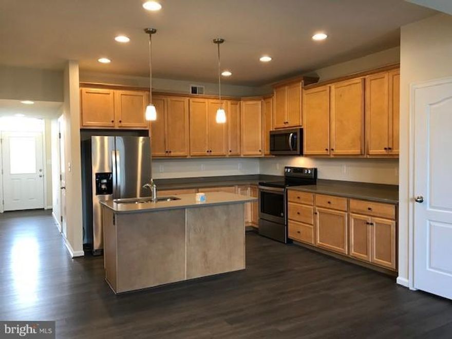 READY FOR MOVE-IN NOW! Brand new 2-level townhomes, 1-car garage. Popular "Alternate 1st Floorplan". The Litchfield II has 3 large bedrooms, 9ft ceiling (1st floor), upgraded rigid core vinyl flooring throughout 1st floor, maple kitchen cabinets w/ crown moulding, granite countertops, stainless steel appliances, upstairs laundry, rear shed and patio.