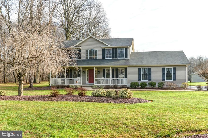 Spectacular colonial on over 2 acres.  Very well maintained home with hardwood floors and ceramic tile on the main floor, 2 story foyer, main level laundry, finished lower level with gas fireplace, beautiful hardscaped patio, large front porch, 2 car garage with access to the basement, shed, oil forced air heat with extra BB electric in lower level.  This home shows extremely well!!