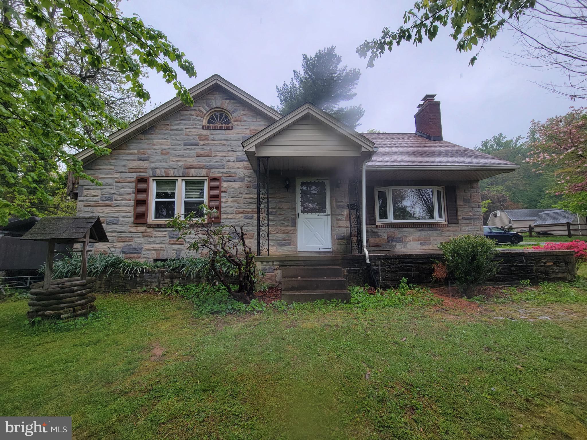 Adorable 4BR/2BA stone cottage style home located in Thurmont. A large front porch with a covered front entrance welcomes you inside this home filled with possibilities. The main floor offers a large bright living room featuring a brick fireplace with a wood burning stove insert, an arched entry into the spacious dining room with chair rail moldings, and an eat-in kitchen with tons of cabinets. Two sizable bedrooms and a full bath complete this floor. Upstairs are two bedrooms with a full bath offering a walk-in shower with the larger primary bedroom giving access to a private deck leading to the yard. The lower level offers storage, laundry, and utilities. The yard offers tons of green space and adult shade trees and shrubs. This home may need a bit of TLC and some imagination but can become the home of your dreams. Imagine all this and in close proximity to shopping, restaurants, and commuter routes.