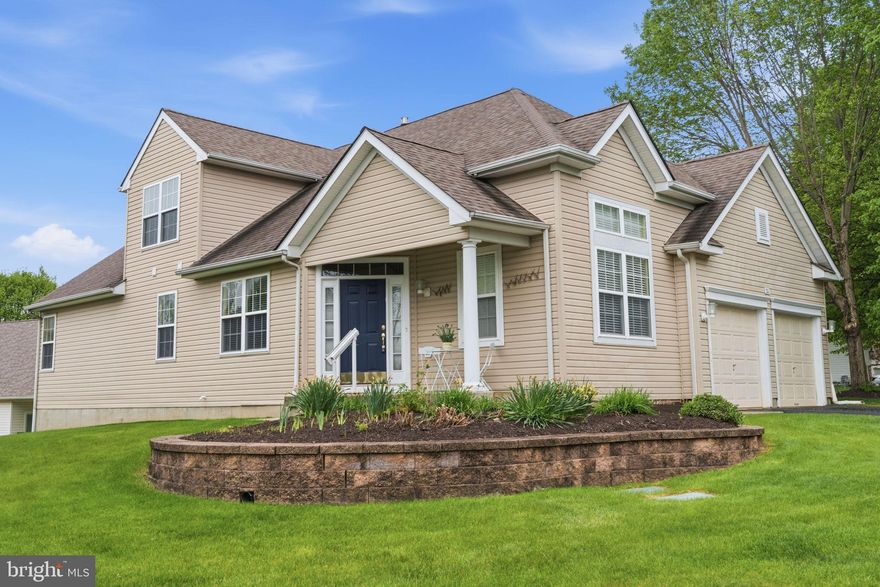 Welcome to 35 Zinnia Way, a single-family home with impressive floorplan in the highly desirable 55+ community of Flowers Mill. From the moment you arrive, the charming covered front porch gives a peaceful space to unwind as well as weather protection for all your deliveries!  Step inside to an impressive foyer featuring soaring two-story ceilings and a striking open staircase that sets the tone for the home’s bright and airy feel. Here, a cozy living room offers a comfortable seating option while you entertain in the adjoining dining room. These front living spaces offer an open, flowing layout filled with natural light.  Follow the timeless hardwood floors to the expansive kitchen, designed for everyday living, featuring a center island, room for a full-size table, white 42" cabinetry, plentiful counterspace and a convenient pantry. The kitchen seamlessly opens to the inviting family room with a gas fireplace, as well as a sunroom filled with natural light and direct access to a large deck, perfect for entertaining families of all size.  The main level also features a generously sized primary suite complete with a full bath, walk-in closet, and a private sitting room, ideal for a home office, reading retreat, or the custom closet space you’ve always envisioned. A powder room and laundry room add to the convenience of first-floor living.  Upstairs, you’ll find a versatile second level featuring a bedroom, loft, and full bath, perfectly suited for both short-term and extended-stay guests, offering comfort and privacy.  Additional highlights include a two-car garage and a partially finished basement with safety egress,  half bath, abundant storage, and a large unfinished space perfect for a workshop, hobby area, or future finishing potential.  Key updates including a newer roof (2018/2019), HVAC system (2020), and water heater (2025), this home offers peace of mind along with its many features.