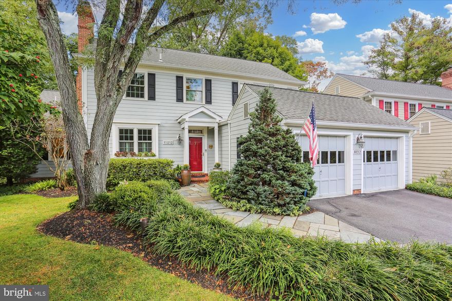 RARE TO MARKET magnificent 3BR+Den/3.5BA colonial with two-car garage and highly desired MAIN LEVEL PRIMARY BEDROOM SUITE located in an exclusive enclave of homes in the coveted neighborhood of The Highlands. This home has been meticulously maintained and thoughtfully improved by the current owner to give you a move-in ready showpiece on three levels with an open concept kitchen/family room on the back of the house with access to a maintenance–free composite deck plus stairs to a flagstone patio underneath, stone retaining walls, Koi Pond, and waterfall.  Special features include Hardie plank siding, replacement Andersen Windows, hardwood flooring throughout the main and upper levels, designer carpeting in the lower level, new custom painting, remodeled gourmet kitchen, three fireplaces, recessed lighting, upgraded lighting fixtures, skylights, plantation shutters, multi-piece moldings throughout, and a finished garage with slatted wall storage system, storage cabinets, and epoxy painted floor. Professional landscaping with an underground irrigation system complements the exterior of the property while the wooded tree-lined setting provides for a private retreat.  Flagstone walkway to front portico and entry to open center hall foyer with oak staircase, designer carpet runner, and skylight at upper landing; updated powder room with quartz vanity; living room/flex office with wood-burning masonry fireplace and built-in bookcases; formal dining room with cupboard closet and elaborate moldings; remodeled gourmet kitchen with skylight, recessed lighting, raised panel cherry cabinets, Silestone countertops, designer ceramic tile backsplash, stainless appliances, Silestone center island breakfast bar, and pantry; breakfast area off of kitchen with French door to Trex deck, vinyl railings, and stairs to flagstone patio underneath; impressive family room with recessed lighting, ceiling fan, and masonry fireplace with gas log insert; private corridor leading to the main level primary bedroom suite with two walk-in closets, ceiling fan, built-in entertainment niche, and triple window overlooking the secluded back yard; primary bath with ceramic tile flooring, 36-inch double quartz vanity with new lighting and plumbing fixtures, two-person whirlpool tub, walk-in shower with ceramic tile surround and frameless glass enclosure, separate water closet, and bonus full-sized stacked washer & dryer; upper-level landing featuring a linen closet and walk-in attic storage with generous built-in shelving; two spacious bedrooms each with ceiling fans and dual walk-in closets; hall bath with ceramic tile flooring, solid surface vanity, and tub with ceramic tile surround; walk-out lower-level recreation room including designer carpeting, recessed lighting, third masonry fireplace with gas log insert, built-in cabinetry and wet bar flanking fireplace, two sets of full windows, and double French doors leading to a covered flagstone patio surrounded by nature in the rear yard; lower-level den/bedroom and full bath with ceramic tile flooring, pedestal sink, and tub with ceramic tile wall surround; two roomy storage closets and a huge finished utility/storage room with multiple closets, full wall of cabinets, a second full-size washer & dryer, and laundry sink.  Structural and mechanical improvements include an architectural shingle roof, Hardie plank siding, oversized gutters with gutter guards, and Andersen replacement windows.  Conveniently located near the intersection of Seven Locks Rd and Democracy Blvd with easy access to the I-495/I-270 corridor, numerous public and private schools, country clubs, and all the retail and restaurants in Westfield Montgomery Mall, Cabin John Mall, Park Potomac, and Potomac Village.