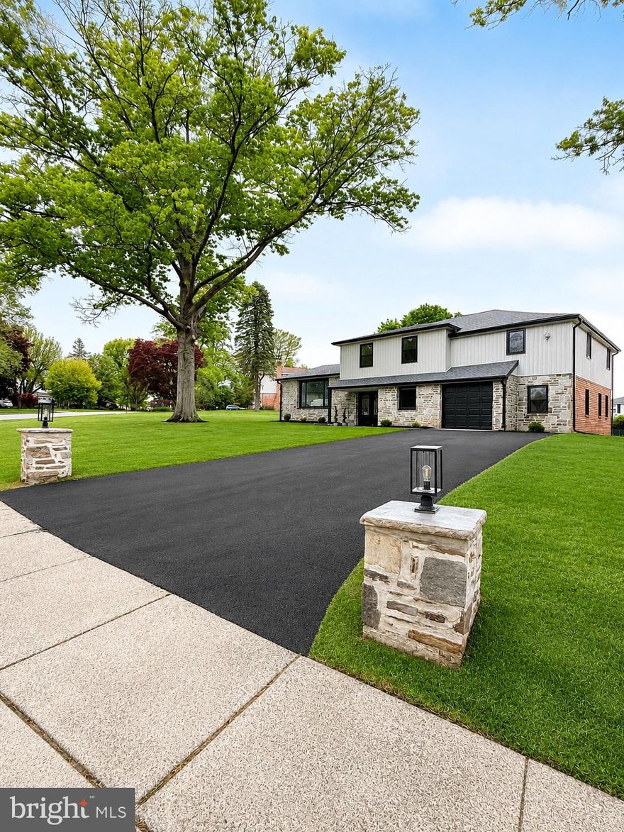 Let’s start with the obvious — homes like this rarely hit the market in the desirable Abidale neighborhood of Huntingdon Valley. Top-rated Lower Moreland School District? Check. Completely renovated from top to bottom? Check. Almost half an acre of space with room for a future pool, spa, firepit setup…or all three because why choose? Also check.This is the kind of house that makes you feel like you’re on vacation without ever packing a suitcase.
Pull up to the home and you’re greeted by a brand new stamped concrete walkway leading to modern double entry doors that instantly set the tone. Inside, everything feels fresh, bright, and thoughtfully designed without trying too hard.
The first floor offers a flexible office space that could easily become a 6th bedroom, gym, or the “I need five minutes of peace and quiet” room. The living room features soaring 10-foot ceilings and a huge panoramic window that brings in tons of natural light all day long. From there, the layout flows naturally into the dining area and straight into the heart of the home — the kitchen.
Quartz countertops, stainless steel appliances, tons of prep space, and a large island that comfortably seats 4+ people — because everyone always ends up in the kitchen anyway.
A few steps down takes you into the cozy family room with a beautiful stone fireplace and sliding doors leading to the newly poured back porch, ready for summer dinners, morning coffee, or pretending you’re going to start gardening this year.
Upstairs you’ll find 5 spacious bedrooms, hardwood floors throughout, modern European-style windows, and 3 fully renovated bathrooms that feel clean, sleek, and timeless.
The finished basement adds even more living space and is perfect for a man cave, movie room, playroom, gym, or all of the above depending on the day.
This home gives you the rare combination of modern upgrades, low-maintenance living, and actual usable space — inside and out. Come see it before someone else decides to host all their future holidays here first.