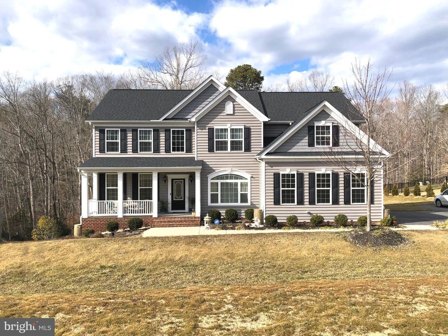 You will love this home, it's truly better than a model*As you enter through the elegant front door with dual side coach lights you are greeted with the 2 story open foyer and beautiful maintenance-free wood floor throughout the entire main level*This house welcomes you with the openness and functionality of the traditional floor plan*The family chefs will love all the kitchen upgrades, from the very eye pleasing quality kitchen cabinetry with soft close doors and under cabinet lighting to the elegant arch window above the large porcelain sink*You will love the ample work area with all the granite counter tops especially the huge center island with gas burners*little fingers and hand prints are a thing of the past with the maintenance-free matted stainless steel appliances*come rain or shine you will still be able to enjoy the outside with the covered porch right off the kitchen*The breakfast nook also leads out to large deck with direct access to the lower patio and yard*The family room with gas fire place and TV mounted above the mantel and pre-wired for surround sound*This house works great for large gathering or cozy get together with the openness and easy free flow between the kitchen, dining room, family room, deck and covered porch*enhance with crown molding on the first and second level*elegant spindles and wood floors reaches the upstairs hallway*as you enter the owners' suite you will be greeted with a spacious room with generous amount of natural light and a second covered porch that encourages you to just stop, relax and enjoy the moment*The master bath will not disappoint with the quality, size and layout*all additional upstairs bedrooms are spacious and enhanced with crown molding and window encasements*This home has so much to offer and we haven't even been in the basement where there a 5th room/bedroom, full bath, an open and light filled family room and entertainment area that's wired for surround sound and direct level access to the patio*This basement level will surely be a treasured area for the family and guests alike*the oversized garage and ample parking makes this energy certified home one you don't want to miss !  Please follow COVID  guidelines!   Hand sanitizer or gloves and shoe coverings are provided at the home.  You may choose to remove shoes or use the shoe coverings. ------- Offer deadline by Monday  night  22nd of March!