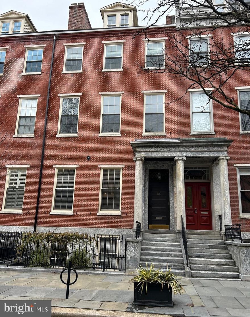 Beautiful one bedroom bi-level condo on historic Portico Row.  Low condo fees! With a desirable southern exposure and glorious natural light, this spacious condo with a unique floorplan and an open concept is ideal for easy living.  Fabulous maple hardwood floors throughout.   New hot water heater in July 2025 and the HVAC was replaced in 2018.  Replacement windows with custom blinds.  The large living area offers built-ins , good closet space and a marble fireplace.  You'll find ample cabinet and counter space in the kitchen along with a built-in wine rack and stainless appliances.  Convenient in-unit stack washer/dryer.  A peaceful rear courtyard  offers a wonderful spot to unwind after a long day.  This Washington Square West location cannot be beat with fine dining, shopping and theatres a short walk away.  You’re also close to Jefferson and Pennsylvania Hospitals, City Hall, public transit, and major highways, including I-676.   Schedule your visit today!