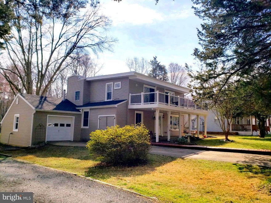 Stunning Craftsman Style Home with Cottage Interior Vibe. Features the Perfect Floor Plan. From the Moment you walk onto the Front Porch pass an Extraordinary Coy Pond and Beautiful Landscaping. As you enter the Foyer into Large Living area with Oversized Fireplace (Gas Conversion) flow into the New Kitchen with Built in Bench Seating, New Flooring and Custom Fixtures with Plenty of Natural Light, Walk out to 16' x 30' Screened-in Back Porch that Overlooks Picture Perfect half acre flat yard and Wooded area at Yards Edge. Enjoy Family Events with Plenty of Parking with Additional Lot and Driveway. Garage has Separate 30 amp hookup for a RV.  New Fixtures, Roof, Siding, Gutters and Down Spouts, Newer Updated Baths are absolutely Stunning! Home has been Waterproofed with Two New Sumps in the Crawl Space, Newer Hot Water Heater and Water Conditioner. Water Privileged Community with Voluntary HOA. Home shows the Pride and Care of 24 Year Ownership.