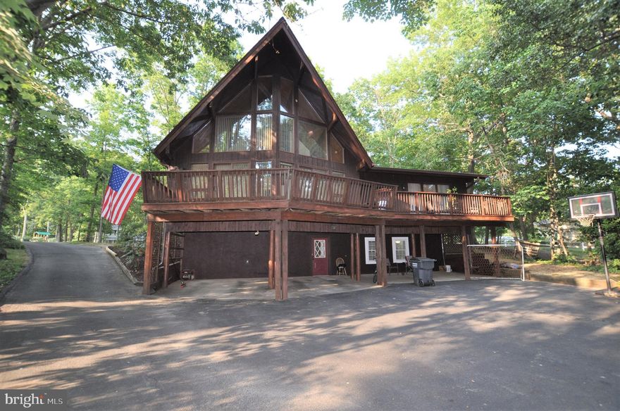 This Lindal Contemporary Cedar home has plenty of room for everyone.  Enjoy the floor to ceiling windows in the A-framed great room with soaring cathedral Wood ceilings, There is a loft overlooking the great room. Fully equipped kitchen comes with loads of cabinets with a pull-out pantry and ceramic tile floors. If you need extra table space or prep area, there is even a hideaway table in the cabinets! You ll enjoy the ample counterspace, too. There are two generously sized bedrooms and a full updated bathroom on the main level as well. There is even a built-in aquarium on the main level. The upper level features a master suite loft with  full master bathroom and a large cedar lined walk in closet. A full finished basement completes this package   there is a large family room and a private guest room with its own full bathroom   great for in-laws or as guest suite. Outside, there are ample sized decks all around, plenty of room for everyone to park on the huge asphalt driveway area (flat and perfect for basketball). New roof was put on in 2017There is over 7/10 of an acre on a quiet street and a shed as well. The entire exterior is freshly stained.  This home has a lot to offer   schedule your appointment to come take a look today!
