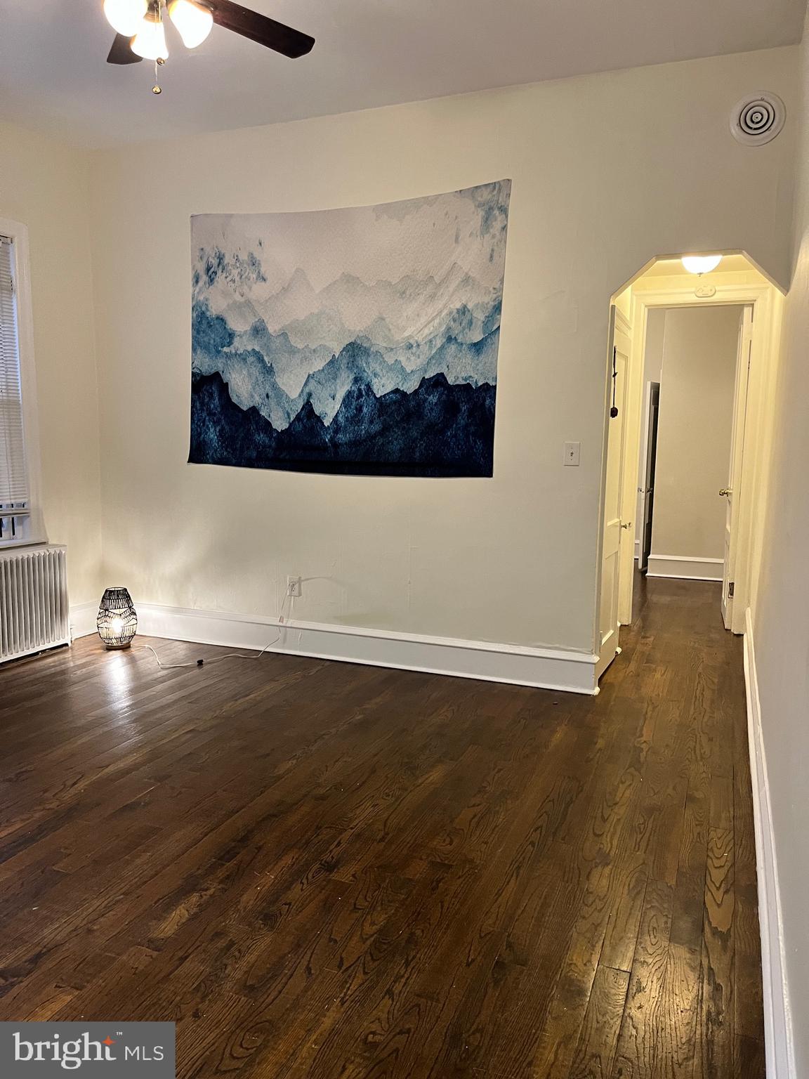 One bedroom unit with direct yard entry plus a bonus room that could be used as a second bedroom. The apartment has walnut hardwood floors throughout, high ceilings and ceiling fans in almost every room. Steps away from the Broad Street Line, a brief walk to TempleU and a quick subway ride to Center City, can't beat the convenience of this location. Pet friendly. Extra storage room in basement included in the rent. Applicants must complete a background and credit check, first last and security requested.