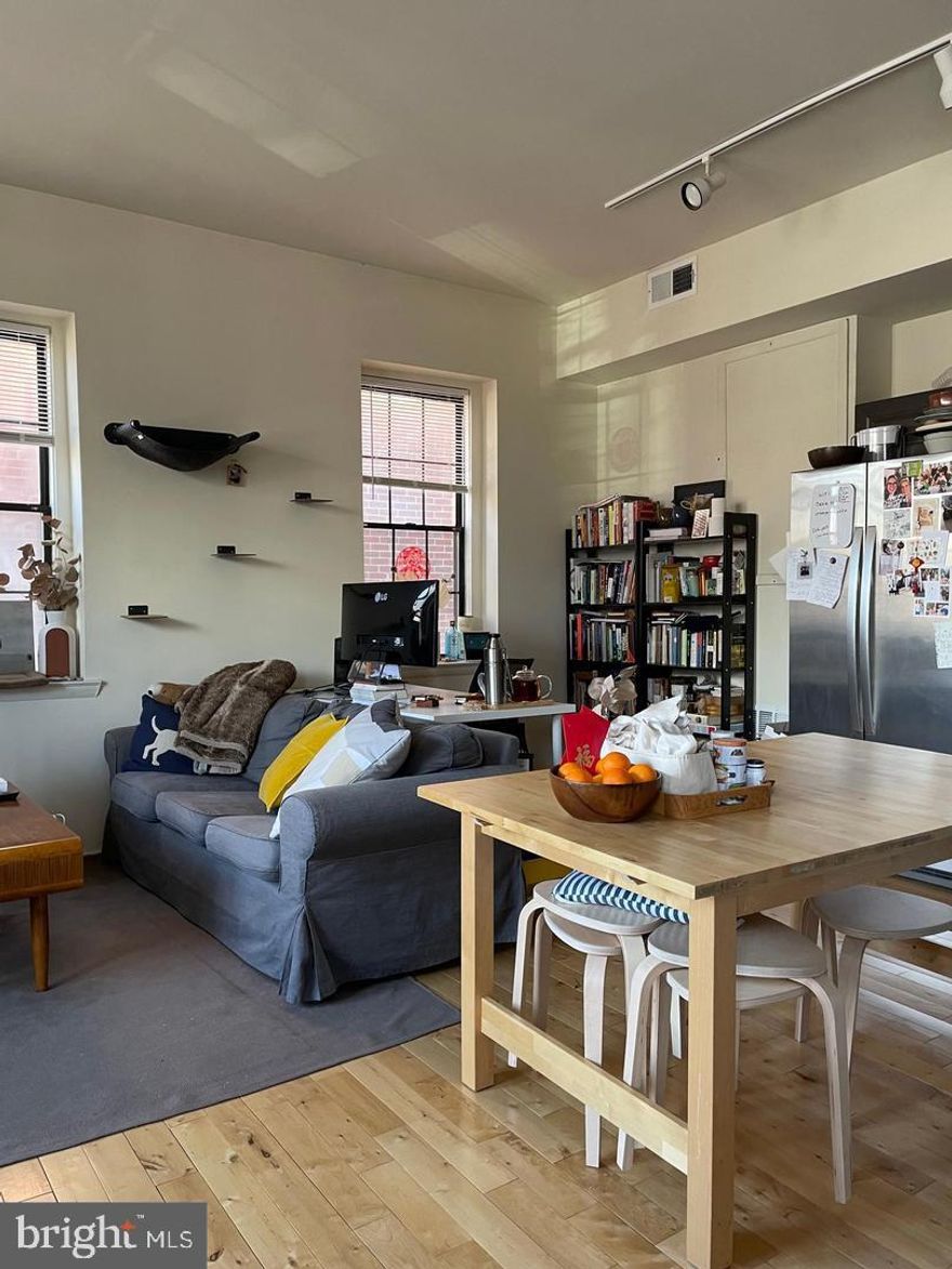 This bright and airy corner bi-level home truly must be seen in person—photos don’t do it justice. Step inside to find an abundance of natural light pouring into the open-concept living and dining area, creating a warm and welcoming atmosphere. The beautifully updated kitchen includes all major appliances (yes, there's a dishwasher!) along with ample cabinet space for all your storage needs. Upstairs, you’ll find two comfortable bedrooms and a full bathroom. Added convenience includes an in-unit washer and dryer and central ac. Outside, enjoy a lovely shared garden space—perfect for relaxing or entertaining. Tenants are responsible for gas, electric, and water. Pets will be considered on a case-by-case basis. Available June 1st!