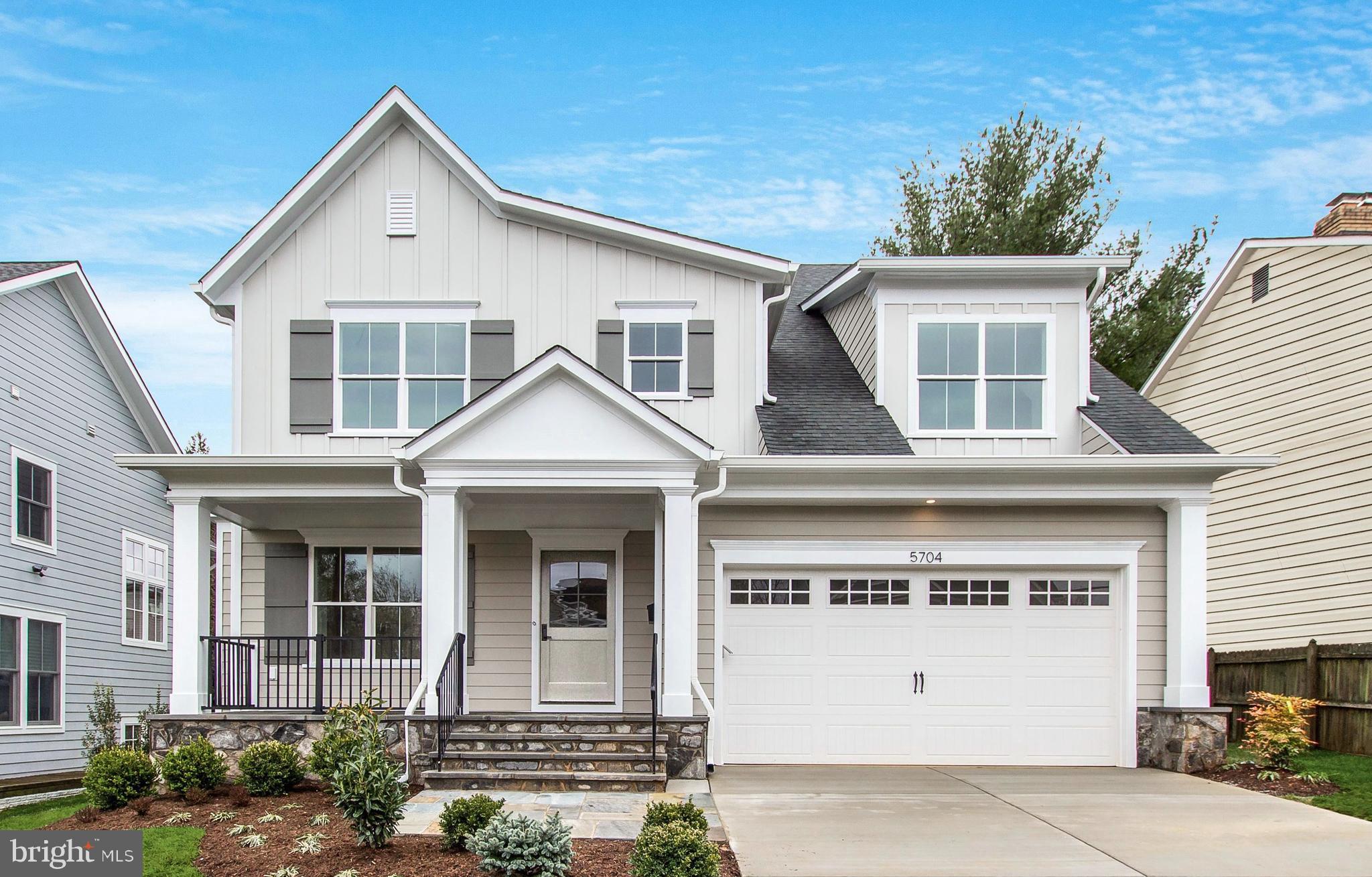Meridian Homes is proud to present 5704 Wyngate Drive, in the heart of one of Bethesda’s most popular neighborhoods. The design of this 5-bedroom, 4.5-bathroom brand-new home perfectly captures the modern farmhouse esthetic. The home is sited so that the gently sloping, fully-fenced rear yard has a southern exposure. The flagstone patio, which is right off the kitchen, offers the perfect place for outdoor living and entertaining. Enjoy strolling through the neighborhood safely on the paved sidewalks.
Inside, the open-concept main living spaces bask in sunlight. The gourmet kitchen features a center island with seating, quartz countertops, designer cabinetry, a stainless-steel apron-front main sink, a walk-in pantry, and professional-grade stainless-steel appliances. The family room has a coffered ceiling, oversized windows and a gas fireplace with stone facing. The main level also features a home office/study, a foyer with a coat closet, a powder room, and a dining room with custom wainscoting. The mudroom offers access to the oversized two-car garage, and has built-in storage lockers, a walk-in closet, and a built-in desk with a home management system. In the garage, there is a dedicated circuit and plug that will accommodate an electric vehicle charger.
Upstairs, the expansive owner’s suite has a tray ceiling, dual walk-in closets with built-ins, a full-length mirrored dressing vestibule, and hardwood floors. The spa-style bathroom features a freestanding soaking tub, an oversized shower with a built-in bench, dual recessed panel vanities, lighted vanity mirrors, solid quartz countertops, honed marble tile flooring, and chrome lever faucets and fixtures. There are three additional bedrooms on the upper level, all designed to be warm and inviting with upgraded carpeting and closets with built-in storage. The two additional bathrooms feature natural stone and porcelain tile tub and shower surrounds, porcelain flooring, and solid surface countertops with undermount sink bowls. The convenient, upper-level laundry room is highly functional with porcelain flooring and cabinetry for storage.
On the lower level of this new home, the recreation room is flooded with natural light from 3 full-size windows. A full bathroom, a bedroom with two large windows, a walk-in closet, a storage area, and a customizable space that can be a gym, media room, or home office complete the lower level.
5704 Wyngate Drive is near acclaimed public and private schools, downtown Bethesda, Montgomery Mall, Wildwood Shopping Center, access to I-495, and Washington, DC.