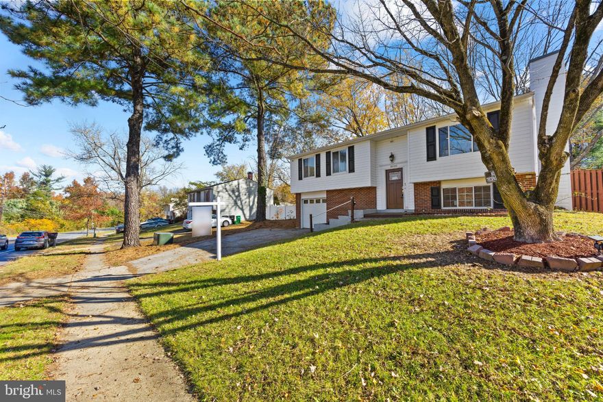 Well-maintained split-level home in Temple Hill Estates! This 4-bedroom, 3-bath property offers an open main level with hardwood floors, a bright living and dining area, and a spacious kitchen with granite countertops, rich cabinetry, and stainless-steel appliances. The finished lower level includes a large family room with a brick fireplace, an additional bedroom or office, and a full bath. Enjoy outdoor living on the freshly updated deck overlooking a fenced yard with mature trees and a storage shed. Complete with a one-car garage and laundry area, this home is in excellent condition and conveniently located just minutes from Andrews Air Force Base, major commuter routes, and nearby shopping and dining.