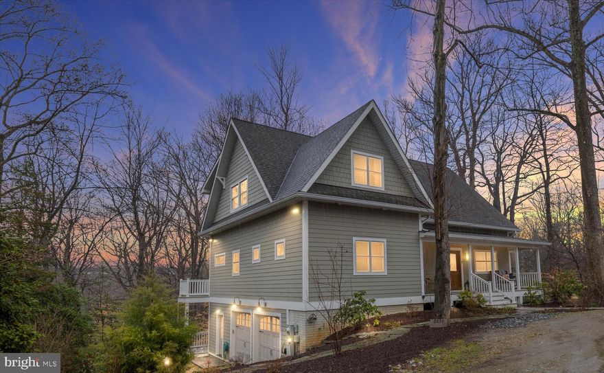 Professional Photos & Aerials coming tomorrow. Virtual tour and floor plans have been uploaded. This custom-built three-level home (2017) in the water-access community of Severn Grove offers timeless architectural character, flexible living spaces, and peaceful wooded surroundings, all enhanced by durable HardiePlank siding.

Custom moldings, rounded walls, Anderson windows/doors, and designer finishes make this home truly one of a kind. With more than 4,800 total sq ft. (estimated), the main level features two bedrooms, two full baths, one of two laundry sets, and an inviting family room anchored by a cozy fireplace with a stone mantel. Gorgeous hardwood floors flow seamlessly into the gourmet kitchen and dining area. Just beyond, a screened porch overlooking mature trees provides a private setting for morning coffee or relaxed evenings surrounded by nature. The outdoor deck and balcony create warm, open spaces for everyday living and entertaining.

The lower level lives like its own private retreat, complete with a bedroom, dining area, full bath, kitchenette, spacious family room, and second laundry set. With a private entrance and covered porch with tranquil tree views, this level is ideal for guests, extended family, or flexible living arrangements.

The upper level has been framed for additional rooms and a future bathroom, offering an exciting opportunity to finish the space and add value while tailoring it to your needs.

Outdoor living is just as inviting with a welcoming front porch, a deck for gatherings, a side yard with a fire pit, and beautiful stone walkways that lead through the gardens to the two-car attached garage.

Located in the water-access community of Severn Grove, residents enjoy a community pier and clubhouse, perfect for crabbing, boating, and embracing life on the water. The waterfront Severn Grove Community Clubhouse is just down the street and is located at 2201 Severn Grv Clb Rd, Annapolis, MD 21401. Experience the perfect blend of nature, comfort, and craftsmanship in this thoughtfully designed home.