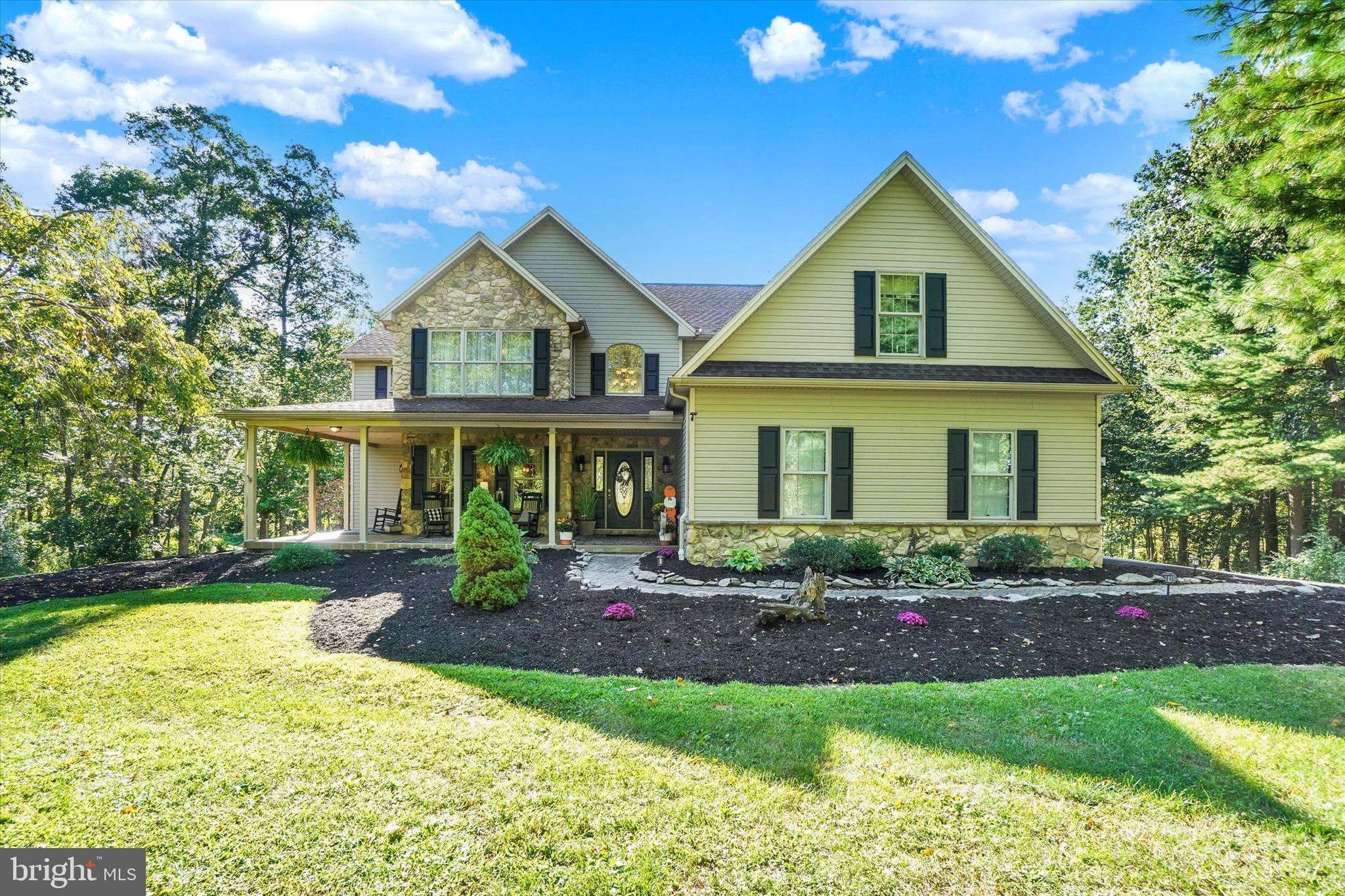 Quiet. Peaceful. A rare combination of luxury, privacy, and natural beauty—perfect for those who value both elegance and tranquility. This custom Musser-built home rests on 3.56 acres with mature landscaping and a treehouse-like vantage. A true nature lover’s paradise, where from almost every window you may spot wildlife and hear the peaceful sounds of nature.
Inside, discover over 4,691 finished sq ft with 5 bedrooms, 3.5 baths, and an attached 3-car garage. The main level offers a formal dining room and a dramatic two-story great room with a floor-to-ceiling stone propane fireplace, opening to an open-concept kitchen with bar-height island, casual dining area, and cozy keeping/gathering room. Thoughtful details include Bitmore Estate hand-carved wood flooring in the dining and keeping room areas, adding richness and character. A main-floor bedroom and nearby half bath provide flexibility for guests, an office, or multi-generational needs. From the kitchen, step onto the deck—ideal for entertaining—with stairs leading directly to the saltwater pool and woods.
Upstairs are 4 bedrooms, 2 full baths, and a convenient second-floor laundry. The private primary suite includes a walk-in closet and its own custom propane fireplace.
The finished walkout lower level is an entertainer’s retreat with 9-ft ceilings, a gas fireplace, dry bar with refrigerator, full bath, and flex space with an option for a 6th bedroom.
Outside, enjoy the resort-style backyard featuring the saltwater pool, new fire-pit area, and hot tub—exceptional privacy for year-round enjoyment. At night, low-voltage hard-wired window candles on all the front windows offer a welcoming glow, highlighting the home’s timeless charm.
Centrally located, this property provides easy access to York, Harrisburg, Gettysburg, and Northern Maryland—blending peaceful seclusion with convenient proximity to regional destinations. Don’t miss out- schedule a tour today!