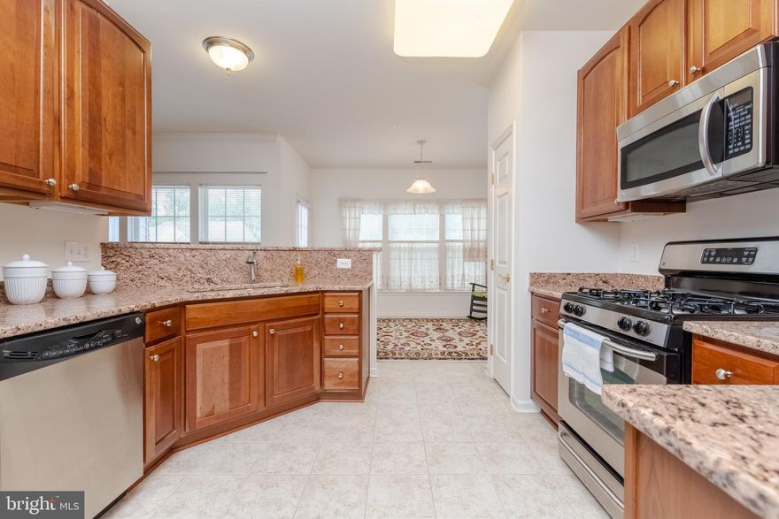 Welcome to Eden Brook.  Includes Buyers 14 Month HOME WARRANTY. Covers repair or replacement cost.  Meticulously maintained.  The well designed  floor plan is very spacious. An open concept through out. One level living and easy care cabinetry and flooring. This home boasts a large living room and kitchen  and a bonus area that could be used as breakfast nook. Large roomy dining area.  The kitchen has beautiful Granite Counters, with soft close drawers and corner Lazy Susan, plus a pantry. The neutral colors go with any furnishings.  This gently lived in home has a great view of the natural shrubbery  and garden area.  You can relax on the Balcony.  Master suite has double sink & easy care shower. You will love the huge walk in closet and sitting area. All appliances included  plus GE Super Capacity Washer and Dryer, for Comforters and large items. Immediate Occupancy, come take a look.