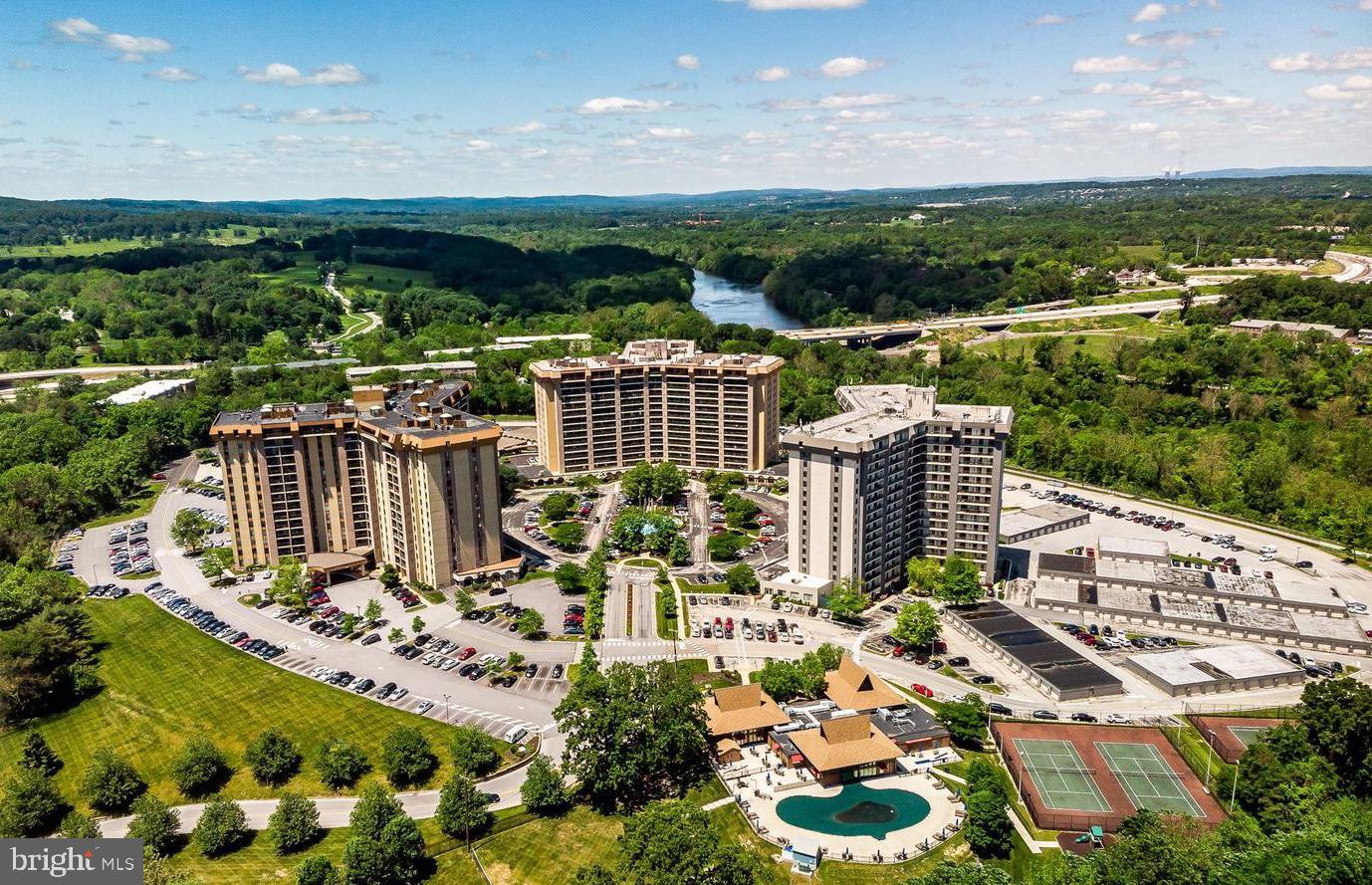 Live the life of luxury and convenience in Valley Forge Towers, located next to Valley Forge Park and just minutes from Valley Forge Casino, the King of Prussia Mall and Town Center. 10407 Valley Forge Circle is a spacious three bedroom condo with a balcony and one car assigned parking. This open floor plan has hardwood floors throughout. The full modern style kitchen with bar seating opens to the dining area and living room with sliding glass doors to the balcony. Situated privately on one side of the living area is the primary bedroom suite with a large walk-in closet, a primary bathroom and access to the balcony. On the other side of the living area, a hall leads to two nice-sized bedrooms, a hall bath with a laundry closet and storage area. Your condo association fee includes the following: Access to tennis courts, pool(s), picnic area, party room, business meeting room, fitness center, jogging/walking path, security systems and security guards, newspaper service, business center with printing, faxing, scanning abilities, elevator, community center, common ground maintenance, clubhouse access, bike trail, basketball courts, on-site banking, on-site barber/beauty salon, on-site restaurants (that will deliver to your condo), as well as a convenience store all within steps from your front door! All utilities are included in your monthly payment with the exception of cable.