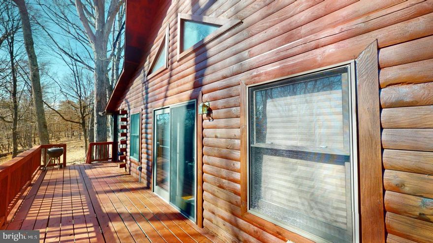 Beautiful 3 bedroom 2 bath cabin in the woods  just waiting for you to make it your home or weekend getaway.    Situated on 11+ acres in the Whitetail Ridge subdivision in a peaceful and serene setting with all the comforts of home.   Large side and back deck to sit on and enjoy the quiet nature sounds and wildlife.  Appliances and wood stove convey with the home.
Roof, fascia, soffit and gutter guards were all replaced back around 2016.   In the past few years, the owner has put in new plumbing, new hot water heater, new fridge, new washer & dryer, new heat pump, new well pump and bladder, new lighting and fan fixtures, new bathroom flooring and a new front deck.  Home was just power washed and stained this past summer.  Large hardwood trees throughout the property.  Don't delay, call today for a showing .    ALL OFFERS DUE BY 5PM SUNDAY FEBRUARY 11TH