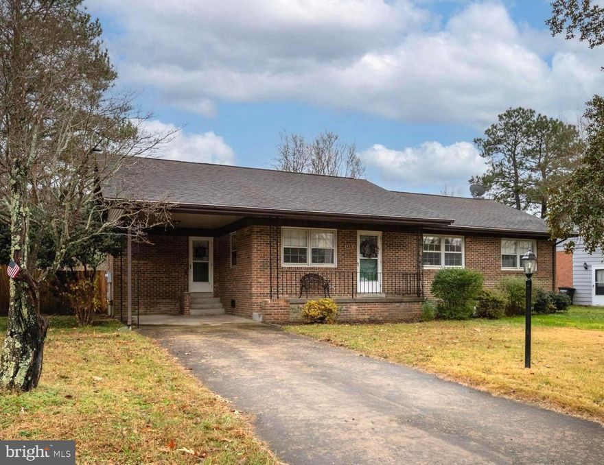 Coming Soon!  Professional photos by 12/3! Open house 12/6 1:00-3:00!  Wonderful all brick home on three lovely lots just waiting for you!  Imagine coming home and being greeted by your covered front porch!  Drive onto your concrete driveway and park your special ride under your covered carport!  So much dedicated parking for cars and golf carts alike!  Enter through the carport entrance and be amazed at the spacious open living area!  Kitchen boasts newer appliances and is open through breakfast area to the dining room!  Just off from the kitchen and dining area is a lovely screened in back porch where you can start the day with your coffee and the morning sun!  Spacious dining area has wood floors and lovely views of the back yard!  Plenty of room for entertaining and hosting meals!  Step through a cased opening to the living room continuing with the wood floors and views of the front yard!  Open the front door and enjoy the evening sun through the storm door and windows!  This home is filled with light and love!  The wood floors continue down the hall and into all three spacious bedrooms!  Primary bathroom recently updated with new shower, vanity and sink!  Hall bathroom offers double sink vanity, linen closet and shower/tub!  All improvements completed since 2021:  new HVAC, all kitchen appliances, encapsulated crawl space, 6 ft wood privacy fence, hot water heater, all lighting fixtures and outlets, leaf gutter guards, updated primary bath, added insulation in attic and new sewer line from home to street!  Fully fenced in back yard with wooden privacy fence!  Attached 9x9 shed perfect for storing your lawn equipment!  Mature Crepe Myrtles and Holly trees grace this home offering a picturesque view from the street!  Multiple rose bushes, flowering bushes, and a flower bed/garden area just waiting for you to enjoy!  In the Town limits but tucked away just enough to enjoy the quiet side of Town!  Enjoy daily water view walks within less than 2 blocks!  Hop on your golf cart and effortlessly scoot over to the festivities and all that Colonial Beach has to offer!  Don't miss out on this wonderful opportunity to make this your home!