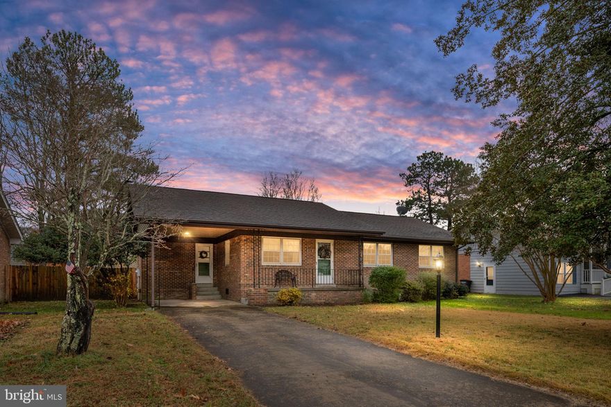 Wonderful all brick home on three lots just waiting for you!  Imagine coming home and being greeted by your covered front porch!  Drive onto your concrete driveway and park your special ride under your covered carport!  So much dedicated parking for cars and golf carts alike!  All improvements completed since 2021:  new HVAC, all kitchen appliances, encapsulated crawl space, 6 ft wood privacy fence, hot water heater, all lighting fixtures and outlets, leaf gutter guards, updated primary bath, added insulation in attic and new sewer line from home to street!  Enter through the carport entrance and be amazed at the spacious open living area!  Kitchen boasts newer appliances and is open through breakfast area to the dining room!  Just off from the kitchen and dining area is a lovely screened in back porch where you can start the day with your coffee and morning sun!  Spacious dining area has wood floors and lovely views of the back yard!  Plenty of room for entertaining and hosting meals!  Step through a cased opening to the living room continuing with the wood floors and views of the front yard!  Open the front door and enjoy the evening sun through the storm door and windows!  This home is filled with light and love!  The wood floors continue down the hall and into all three spacious bedrooms!  Primary bathroom recently updated with new shower, vanity and sink!  Hall bathroom offers double sink vanity, linen closet and shower/tub!  Fully fenced in back yard with wooden privacy fence!  Attached 9x9 shed perfect for storing your lawn equipment!  Mature Crepe Myrtles and Holly trees grace this home offering a picturesque view from the street!  Multiple rose bushes, flowering bushes, berry vine, mint and a flower bed/garden area just waiting for you to enjoy!  Low maintenance yard, easily maintained by electric mower!  In the Town limits but tucked away just enough to enjoy the quiet side of Town!  Effortless star filled views of the night sky from your driveway!  Enjoy daily water view walks within less than 2 blocks!  Hop on your golf cart and effortlessly scoot over to the festivities and all that Colonial Beach has to offer!  Don't miss out on this wonderful opportunity to make this your home!