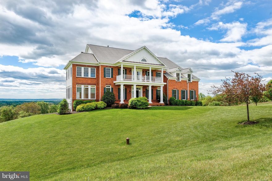 Amazing Renovated Gem w/ over 9,800 sqft perched on 8 prime acres w/ pristine views! Vast open flrpln w/ separate office, liv/din rm, chefs kit, sunrm, & 2 story fam rm w/ stone fp. Upper lvl 5 lg en suites. MA BR w/ sitting rm, dual side fp, walk ins, & balcony. Oasis MA BA w/ 2 vanity, sep tub, & sep shower. Lower lvl w/ lg rec rm & full BA finished. Space for 6th BR, kit, & media rm w/ wet bar.