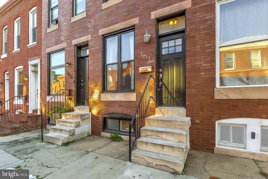 BEAUTIFULLY DESIGNED FEDERAL HILL RENOVATION WITH 3 FINISHED LEVELS & 2+ CAR PARKING! Hardwood floors throughout upper levels, spacious living room with exposed brick, separate dining room, designer kitchen w/ granite counters & SS appliances, Master suite w/ full bath & rear deck, 2nd bed w/ hall bath, finished basement w/ 3rd bedroom & 3rd full bath, & oversized parking pad! Located steps from Federal Hill restaurants!