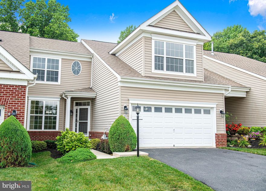 Welcome to 188 Touch of Gold, your dream Villa-style townhome nestled in the prestigious Bulle Rock community of Havre de Grace! This four-bedroom, three-and-a-half-bath residence is your gateway to a worry-free lifestyle, surrounded by resort-like amenities and minutes away from Interstate 95.  Upon entry, you'll be greeted by an inviting eat-in kitchen boasting bright, big windows that flood the space with natural light. The open layout ensures easy movement, while the kitchen itself is equipped with sleek black appliances, including a gas range and a brand-new Frigidaire refrigerator. Revel in the desirable functionality of spacious granite countertops, ample cabinet storage, a convenient center island with counter seating, and recessed lighting. Travel beyond the kitchen to find two additional pantry closets, a half bath, a laundry/mudroom with additional cabinet storage, and access to the garage. The large combination dining and living area is situated in the rear of the home with serene views of a private wooded area through double sliding glass doors. Stay cozy during winter evenings with the warm embrace of a gas fireplace, all while reveling in the airy ambiance provided by the high ceilings. Hardwood floors span throughout the living space seamlessly into the entry-level owner’s suite, which is a true haven with its tray ceilings, large windows, and a generously-sized walk-in closet. The private owner’s bath offers a double vanity sink, a luxurious soak tub, and a walk-in shower. Ascend the open stairway to the second level, adorned with new carpet, where you'll find a versatile loft area ideal for an office or a cozy sitting spot. The first bedroom on this level is highlighted by a cathedral ceiling and offers a step-in closet with personal access to the hall bath. The second bedroom is both spacious and charming, boasting a double window and a decorative oval window. But that's not all! The lower level of this home is a vast, finished area with new carpet and recessed lighting. Here, you'll find a full bath and an additional bedroom, making it the perfect private space for guests. With walk-out access to the rear yard, this level seamlessly integrates indoor and outdoor living. Residents of this gated community relish in a friendly and active atmosphere, enjoying the convenience of being minutes away from the historic waterfront city of Havre de Grace where you can enjoy plenty of options for eating, shopping, and outdoor recreation. 188 Touch of Gold awaits to redefine your concept of comfortable, resort-style living. Don't miss your chance to call this captivating townhome yours!