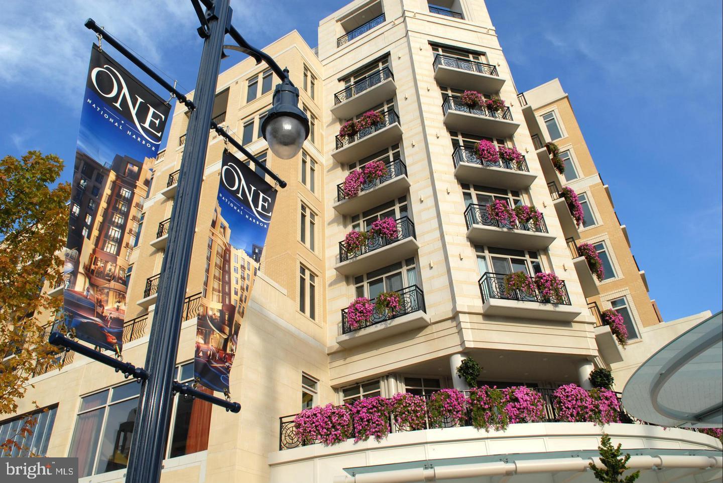 Presenting one of the largest one-bedroom, one-bath residences at One National Harbor, offering over 800 square feet of refined living space. Situated within the premier flagship building of the One National Harbor Condominium, this exceptional home combines luxury, comfort, and convenience in one of the area's most sought-after communities.
This move-in ready unit features elegant hardwood flooring and has been freshly painted throughout. The spacious living area includes a custom stone built-in and a separate sitting area, ideal for relaxation or entertaining. The bedroom is generously sized to comfortably accommodate a king-size bed and includes a custom closet system for optimal organization. Additional highlights include updated lighting fixtures, abundant natural light through expansive windows, ample storage space, and a full-size LG front-loading washer and dryer.
Residents enjoy access to a full suite of amenities, including on-site building management, concierge service, a rooftop pool, an observatory deck with panoramic views of the Potomac River, Washington, D.C., and Alexandria, a community lounge with a terrace, and a state-of-the-art fitness center.
This residence conveys with one assigned garage parking space (#148).