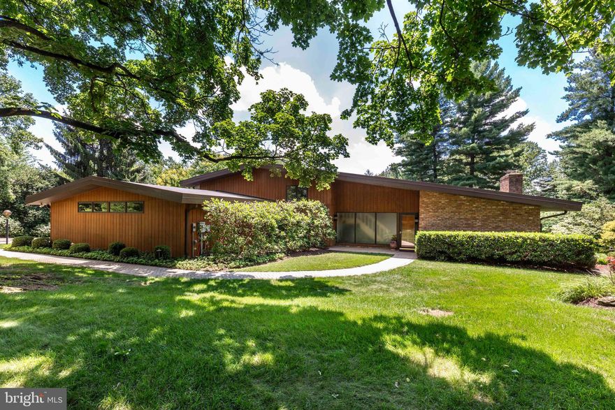 *Welcome to “The House on THE HILL” — a rarely available, one-of-a-kind custom contemporary home, thoughtfully designed and lovingly maintained by its original owners*Perfectly positioned in the heart of Westminster, this 4 Bedroom, 3 Full Bath residence offers the ideal blend of privacy, architectural character, and walkability to downtown Westminster’s restaurants, shopping, and amenities*Set on a remarkable combined 1.278 acres (including a .984-acre homesite plus an additional .294-acre buildable lot), this property offers space, flexibility, and future potential rarely found in this location*From the moment you arrive, the home’s distinctive presence stands out*The exterior showcases a stunning 52’ x 15’ custom paver patio with sitting wall, a second upper-level patio, and a private balcony off the primary suite — creating multiple outdoor living spaces ideal for entertaining or quiet relaxation*Beautiful landscaping surrounds the home, highlighted by two ornamental fish ponds, while the oversized garage and expansive driveway provide generous parking*Inside, natural light pours through large windows, illuminating vaulted ceilings, exposed wood beams, brick accents, and rich real wood floors*The open-concept main level features a custom-updated kitchen (2022) with high-end cabinetry, quartz countertops, and premium appliances which flow seamlessly into a warm and inviting family room with a wood-burning fireplace*This level also includes a light-filled dining area, a main-level bedroom for you to age in place, an updated full bath, and a conveniently located laundry/utility room — ideal for flexible living arrangements*A welcoming slate-floored foyer leads to a dramatic living room anchored by a second wood-burning fireplace, creating an impressive yet comfortable gathering space*Overlooking the living and dining areas below, the upper-level office adds architectural interest and functional versatility*The upper level also features a spacious primary suite with private balcony access and a luxurious primary bath complete with soaking tub, separate shower, and updated quartz double-sink vanity*Two additional bedrooms and another full bath complete this level*Unique storage cubbies throughout the home add both charm and practicality*Additional highlights include energy-efficient dual-zone HVAC systems, newer high efficiency glass on large windows (2016), and thoughtful custom details that make this residence truly special*Architecturally distinctive, beautifully maintained, and ideally located — this is a rare opportunity to own a contemporary gem on one of Westminster’s most desirable settings*