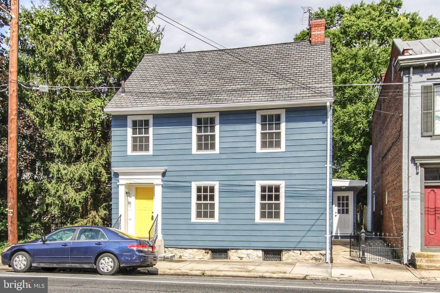 Live spaciously in the historic area of Carlisle. This newly-renovated 4 bedroom, 2.5 bathrooms has everything you want! The stunning foyer will greet you first walk in the door. The tile flooring and the shiplap coat area will give this historic home the modern flair. Then you will be greeted by the living room which includes a gas fireplace for those chilly evenings. Walk through the archway into the formal dining room that has an incredible light fixture that adds so much charm to the room. The dining room is large enough for those extra special gatherings. Next is the immaculate kitchen From the 10 foot island to the sparkling quartz countertops to the stainless steel appliances to the beautiful backsplash. This kitchen truly is the best of the best. From the kitchen you will walk down into the family room. This living space is very cozy. Upstairs you will find the luxurious master suite, with a newly renovated bathroom featuring a gorgeous tile shower with a glass door. There are two additional spacious bedrooms and a second full bathroom upstairs. As an extra special bonus to this already fabulous home, there is a laundry area on the second floor. We are not done yet. The 3rd floor not just finished, but it is heated and cooled and has an extra-large closet, making it a 4th bedroom. Hardwood floors, soft close cabinets, modern light fixtures, brand new half bathroom, full basement, new plush carpet, modern style tile flooring. You will enjoy the large covered rear patio with plenty of room for summer barbecues and a quiet cup of coffee year-round. The detached 3 garage is HUGE and has a brand new concrete floor. Located within blocks of local history, Carlisles best coffee shops and restaurants ... and just a short walk to the YMCA.  Enjoy the best of Carlisle living from this centrally located home with all the amenities you want!