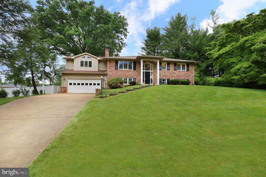 One of a kind, incredible home built for entertaining. This stately Mantua split foyer boasts a fabulous kitchen addition and decorator touches everywhere on a fully fenced and exquisitely manicured lot. Expanded kitchen addition with 12 ft cathedral ceilings and second stairway to lower level and garage, double sinks, double wall ovens, double dishwashers, 40 linear feet of quartz countertops, 6' x 7' island, stainless steel appliances, generous pantry. Huge windows, incredible space. Custom designed living room with electric fireplace feature and large dining room to seat 12, all with recessed lighting and hardwood floors. Extra large windows provide openness and tons of natural light. Electric blind over two story entry window. Walk out from dining room to enormous (recently seated 50 for dinner!) covered and uncovered Trex deck and lovely, flat, fully fenced backyard with storage shed, lower level access and stamped concrete walkway.  Three generous bedrooms upstairs, one with fully updated en-suite. Updated hall bath. Two more bedrooms downstairs and two more full, beautifully updated baths. Generous family room with fireplace, access to garage and yard. Lower level laundry (three years young!) and utility room. Tons of storage. HVAC replaced within last three years with dual units.  Separate HVAC in garage installed 2022. Whole house exhaust fan. New attic insulation, upgraded windows. Architectural features. Two-car garage. 

Mantua Pool Membership Available to convey with this home. 

Easy commuting, with a bus stop right down the street on Glenbrook Rd and Metro access easy from there. Or work from home in your serene and private backyard all summer long! Just a few miles from I495 and I66. Close to shopping, dining, Fairfax City attractions, houses of worship and more.